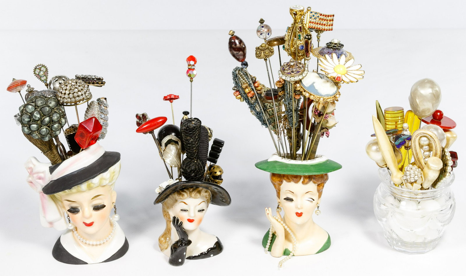 Hat Pin Assortment: Hat Pin Assortment Including approximately seventy-five hat pins of various lengths and ages, some having bakelite, pearls, cameos or rhinestones; together with hat pin holders and head vases Conditio