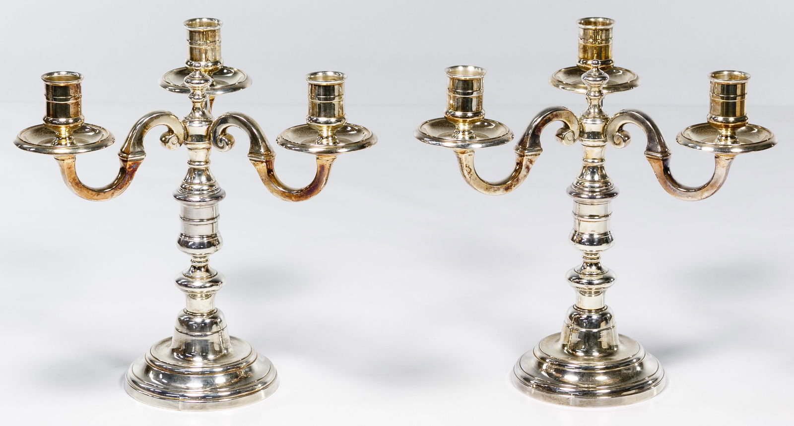 Emile Puiforcat Silverplated Candle Holders: Emile Puiforcat Silverplated Candle Holders Paris, pair of Puiforcat silver plate three-light candelabras having curved scroll branches and bobeches Condition: Very Good, overall very light wear, very