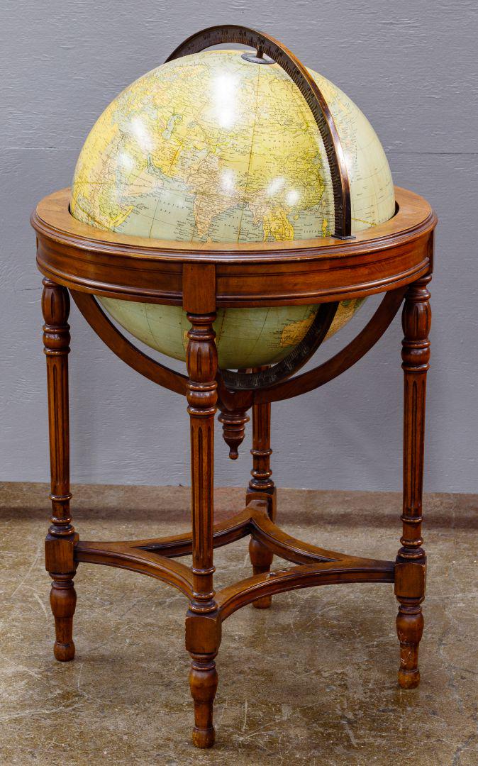 Terrestrial Floor Globe: Terrestrial Floor Globe c.1930; terrestrial globe having brass armature on a circular light brown mahogany stand; depictiing 'Japanese Empire', 'Italian Somaliland' and 'French Indo-China' Condition: