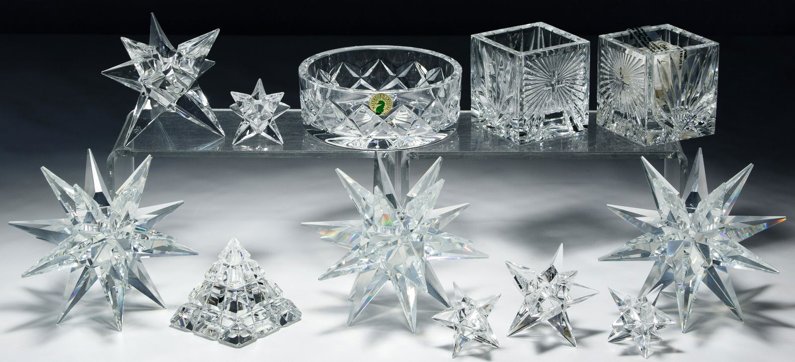 Waterford and Swarovski Crystal Assortment: Waterford and Swarovski Crystal Assortment Twenty items, twelve pieces of marked Waterford including a pyramid paperweight, six wine stops, a wine coaster, two 'Christianity 2000' votive candle holder