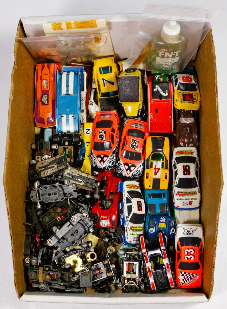 Slot Car, Body and Under Carriage Assortment: Slot Car, Body and Under Carriage Assortment Thirty bodies; approximately twenty complete and partial chassis marked 'A/FX', made by Aurora; together with a few partial Tyco Pro chassis, numerous loos