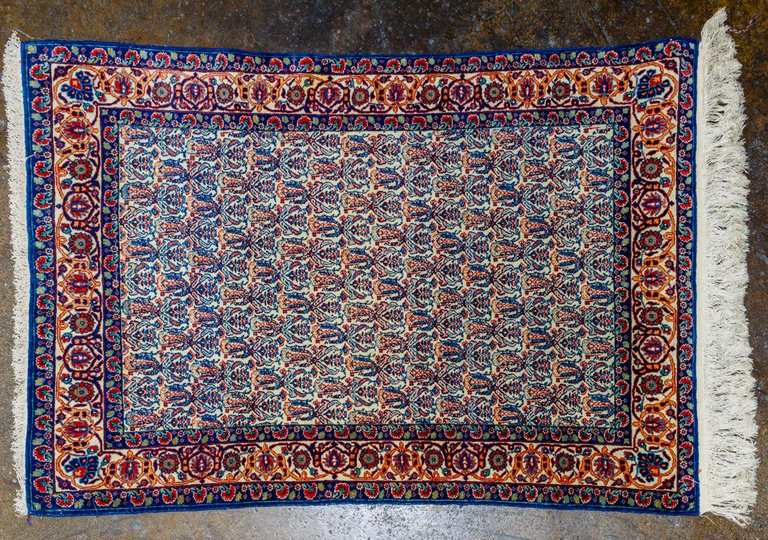 Persian Qum Rug: Persian Qum Rug Having repeating patterns of blues and rust across and down the central field of cream color, surrounded by three floral borders of darker shades of blue, rust, gold and green Conditio