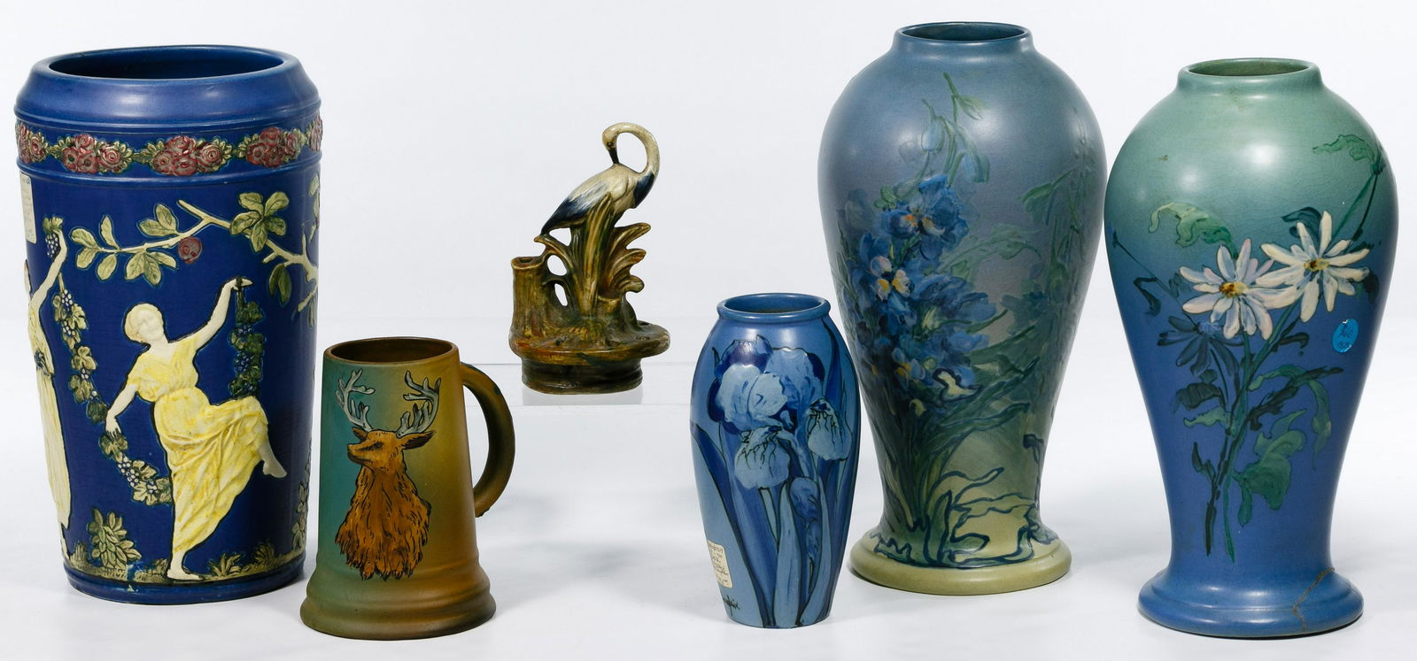 Weller Pottery Assortment: Weller Pottery Assortment Six items including a KKT blue irises vase signed McLaughlin, a Dickensware mug, a Woodcraft flower frog, a Blueware vase of greek maidens design, a Hudson vase signed Claude