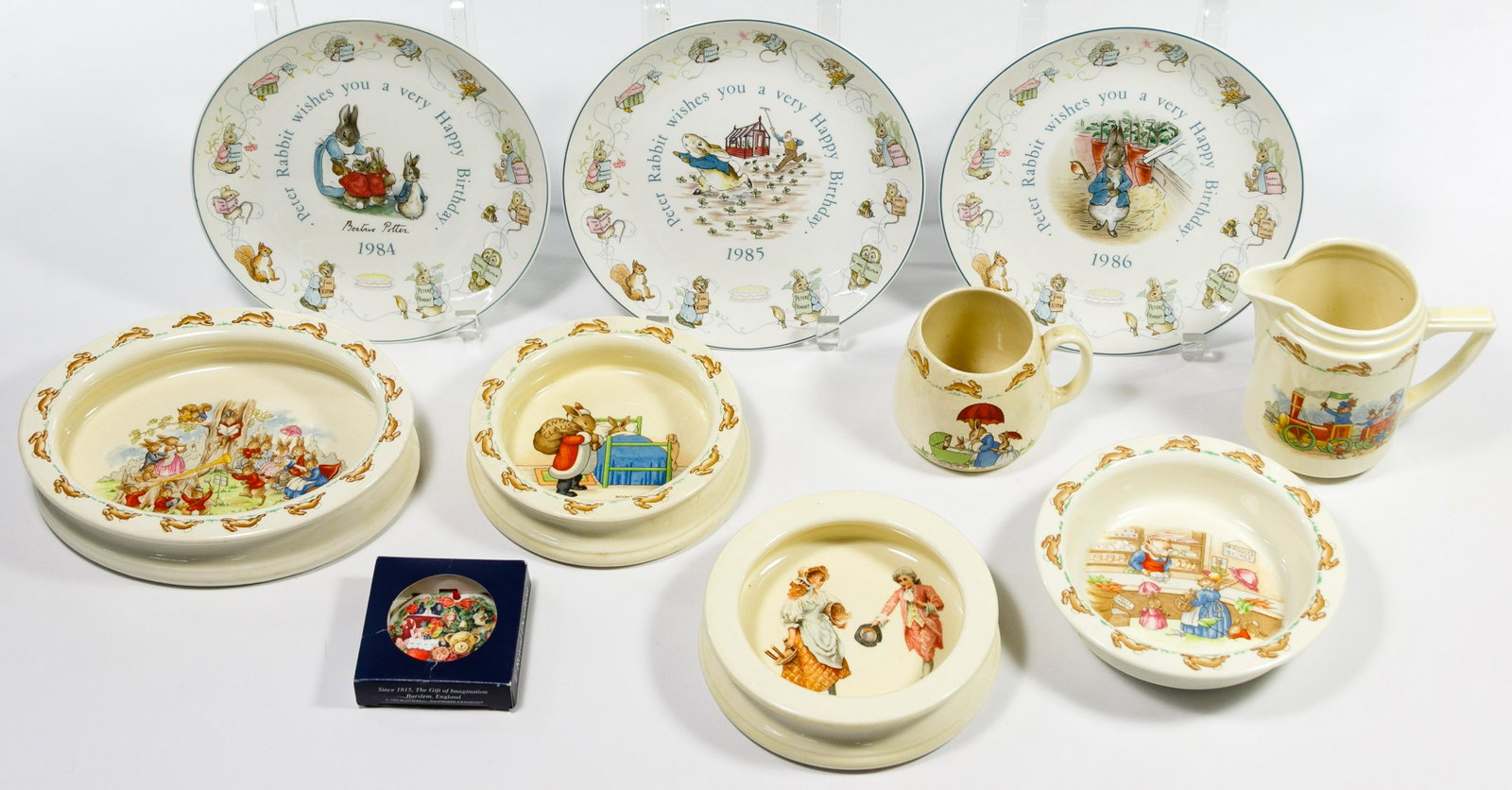 Royal Doulton Bunnykins China Assortment: Royal Doulton Bunnykins China Assortment Thirty-nine items including twenty-eight 'Bunnykins' pieces including plates, porridge bowls, a nursery set in original box, cups, egg cups together with four 