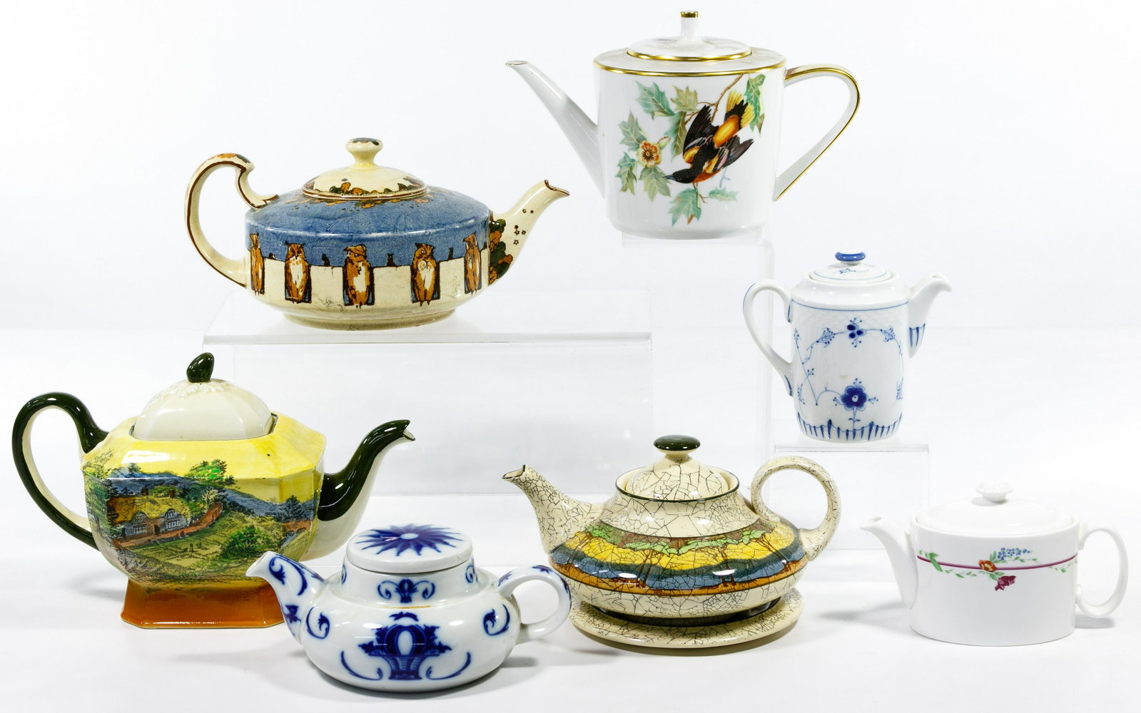 Royal Doulton Teapot Assortment: Royal Doulton Teapot Assortment Thirty items including stoneware and porcelain teapots with various motifs such as floral, animals, mythical and landscapes; together with other makers including Royal 