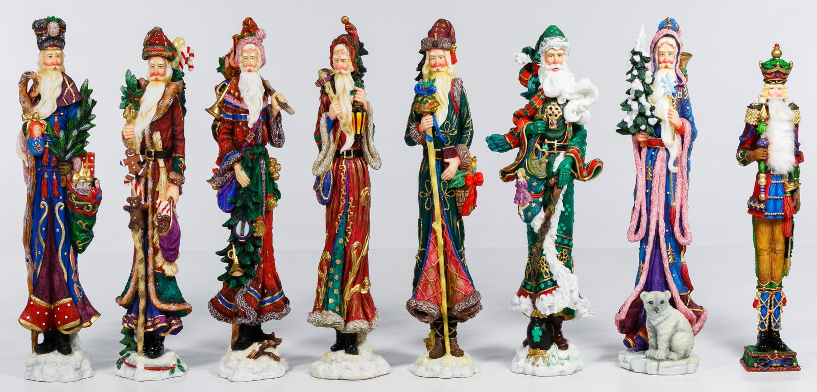 Lenox Santa Figurine Assortment: Lenox Santa Figurine Assortment Nineteen porcelain and composite Pencil style Santa figurines including 'The Spangled Santa', 'The Kringle Visit', 'The Christmas Wish', 'Santa Claus', 'Kris Kringle', 