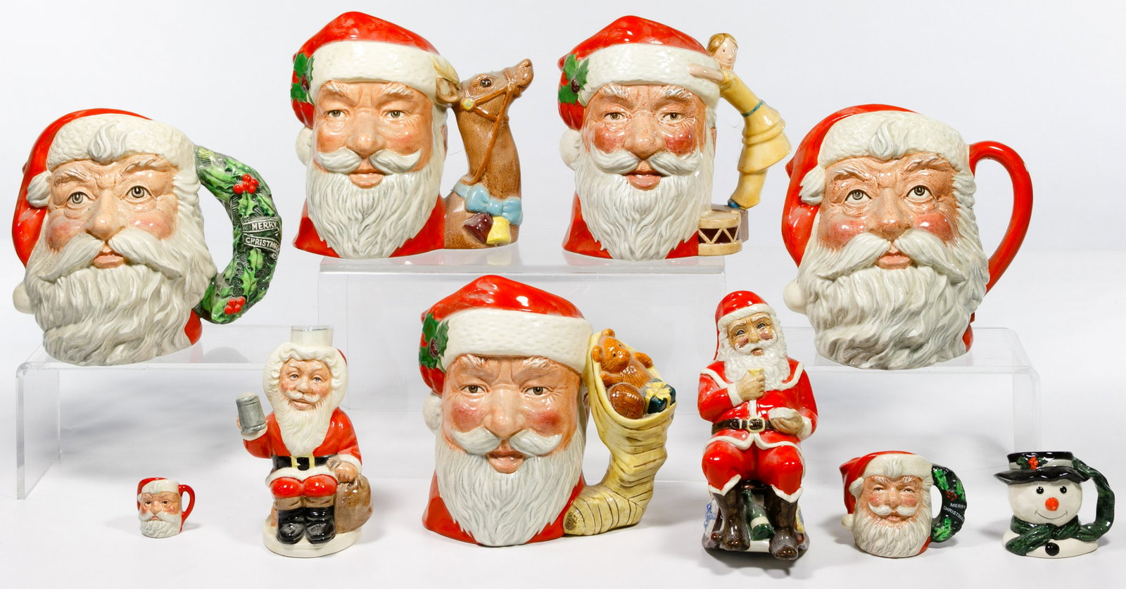 Royal Doulton 'Santa' Toby Mug Assortment: Royal Doulton 'Santa' Toby Mug Assortment Ten items including #6668 'Santa Claus' dated 1981, #6675 'Santa Claus' dated 1982, #6690 'Santa Claus' dated 1983, #6900 'Santa Claus' dated 1987, #D6950 'Sa