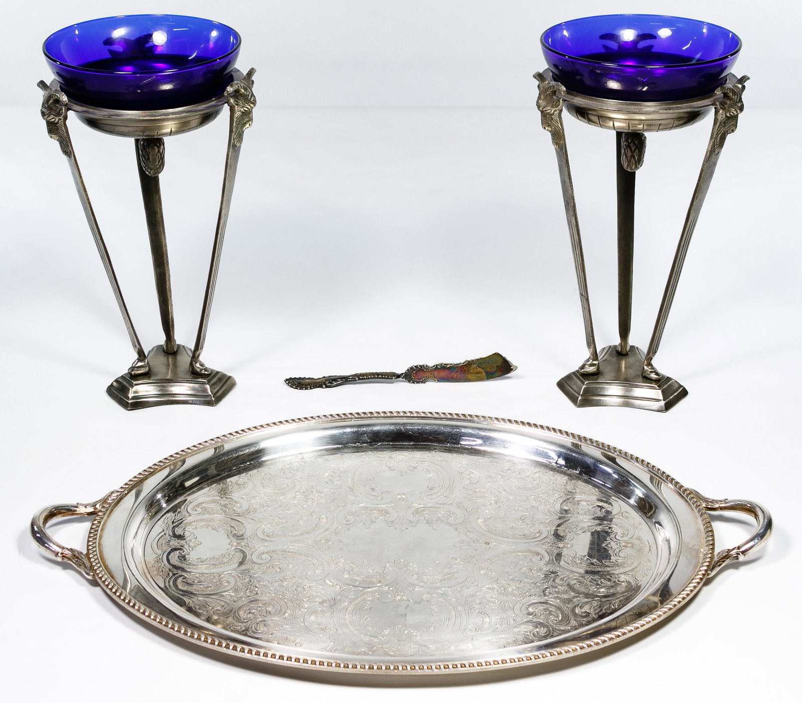Cast Metal and Cobalt Blue Glass Torchieres: Cast Metal and Cobalt Blue Glass Torchieres Pair of table-top size metal torchieres with cobalt glass bowls; together with an oval electroplated tray by Poole and a Wm. Rogers silverplate butter knife