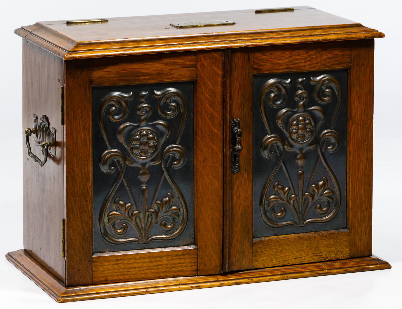 English Victorian Oak and Brass Desk Box: English Victorian Oak and Brass Desk Box 1910, flip-top wood box fitted with two drawers, two shelves, a tray and brass racks behind two locking doors; side handles; engraved brass plate to Geo. Horsf