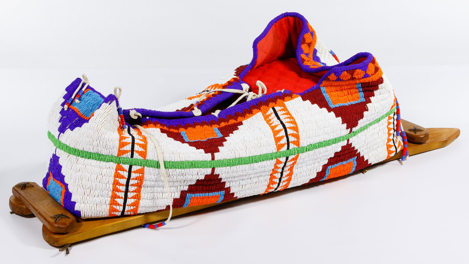 Native American Beaded Cradle: Native American Beaded Cradle 20th-century, high quality fully beaded Native American papoose carrier on wooden frame with thousands of tiny beads, deluxe workmanship and highly decorative, quilted an
