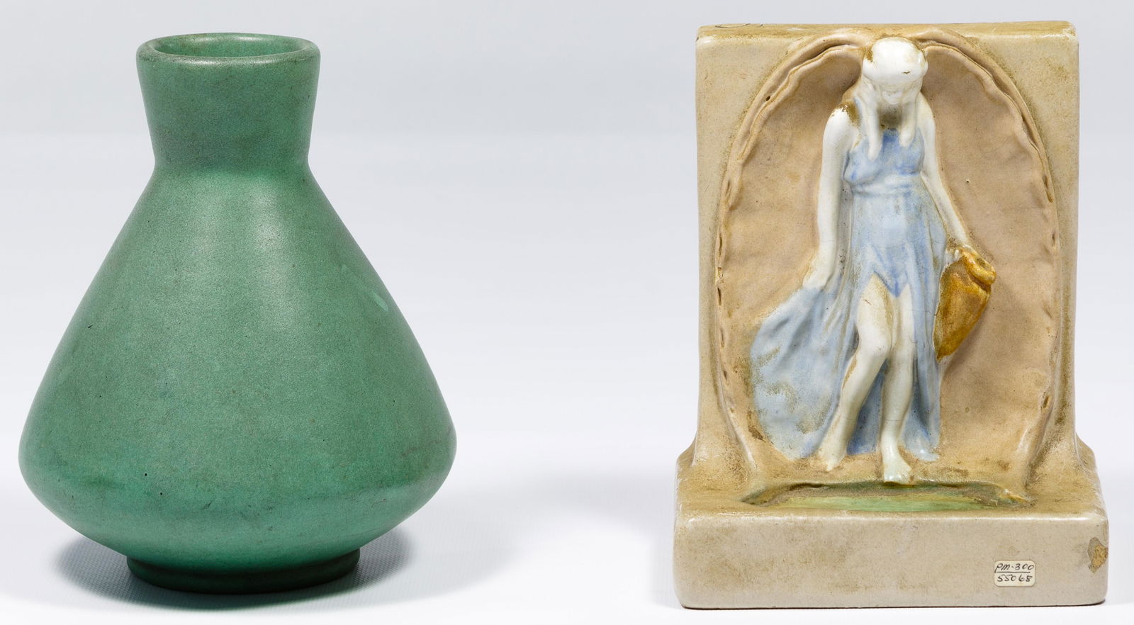 Teco Pottery Vase and Bookend: Teco Pottery Vase and Bookend Two items including a matte green vase and a 'Rebecca at the Well' bookend with colored glaze both marked on underside Condition: Very Good to Good, vase having 2cm x .5c