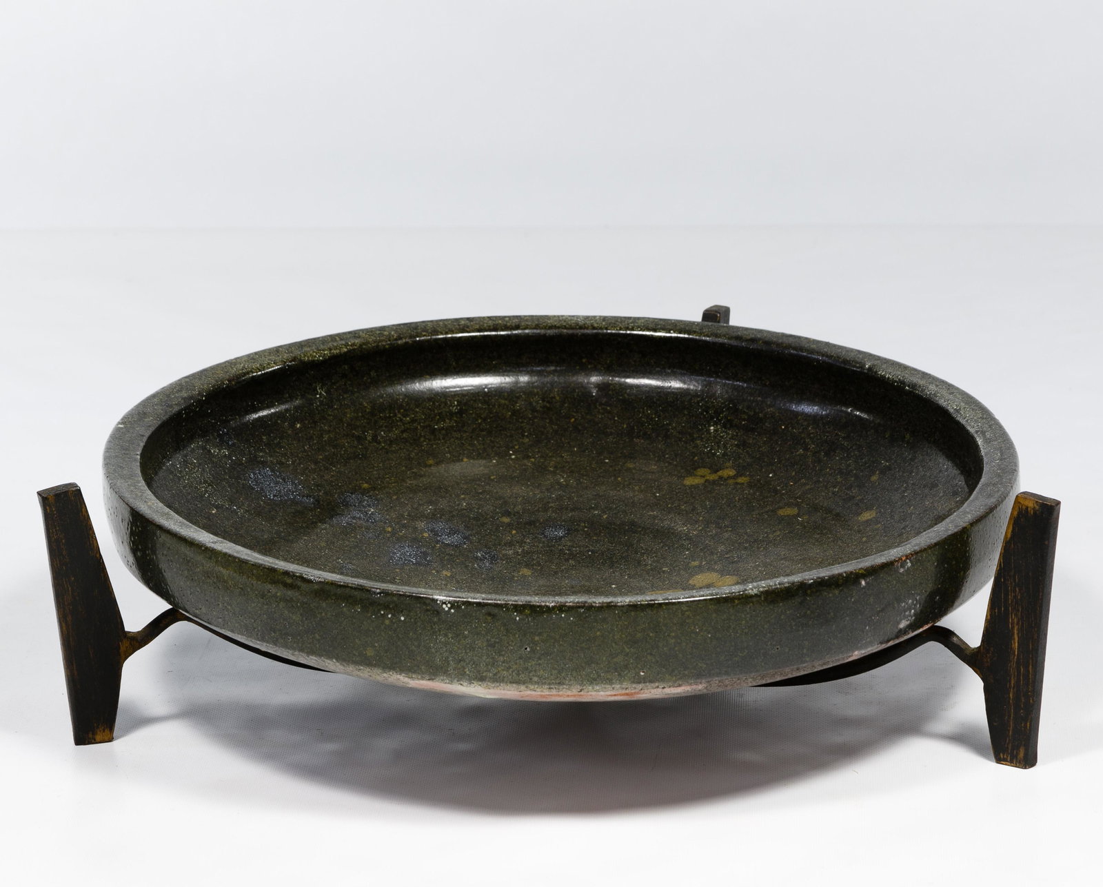 Spanish Alfaraz Art Pottery and Stand: Spanish Alfaraz Art Pottery and Stand Earthenware bowl with metal black and copper stand having maker tag on underside Condition: Very Good, overall light wear consistent with age and normal use; no c