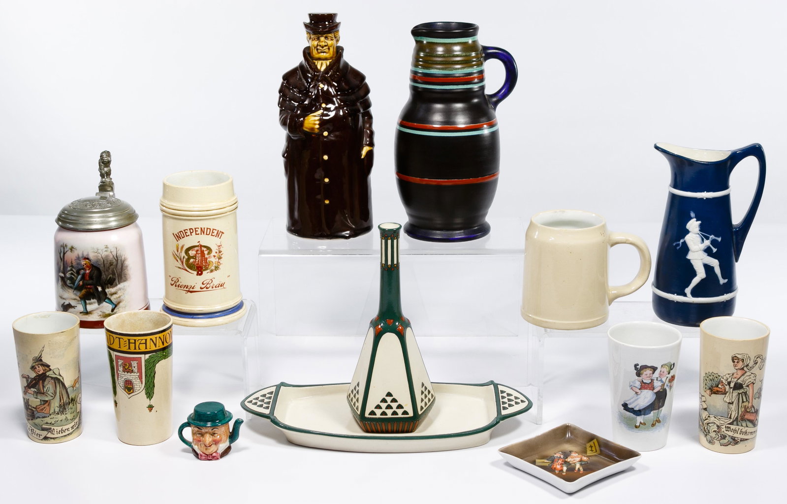 Pitcher, Stein and Mug Assortment: Pitcher, Stein and Mug Assortment Fourteen items including Mettlach pitcher #3194; Mettlach tray #3181 with unmarked, but matching vase; Mettlach cups #1389, #1200, #1025, #1023; Mettlach mug #1526; G