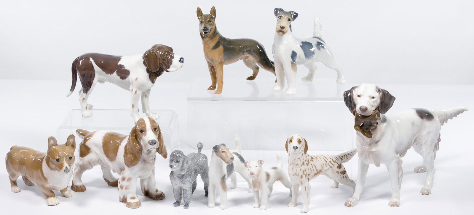 Royal Copenhagen and Bing & Grondahl Dog Figurine: Royal Copenhagen and Bing & Grondahl Dog Figurine Assortment Ten figurines including seven examples from Royal Coppenhagen #325, #4857, #2967, #3261, #3165, #4754, #4593 and three examples from Bing &