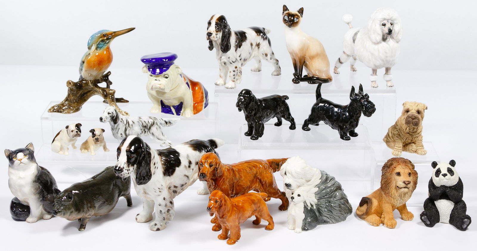 Royal Doulton Animal Figurine Assortment: Royal Doulton Animal Figurine Assortment Fifteen figurines including dogs, cats and a pig, all having a Royal Doulton mark; together with four animal figurines by various makers Condition: Very Good t