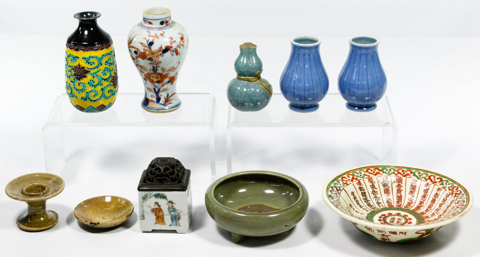 Asian Pottery Assortment: Asian Pottery Assortment Nine stoneware and porcelain items including three small vases marked on underside, two unmarked vases, a Ming-style Celedon censer, a song lamp and dish, a square box with ca