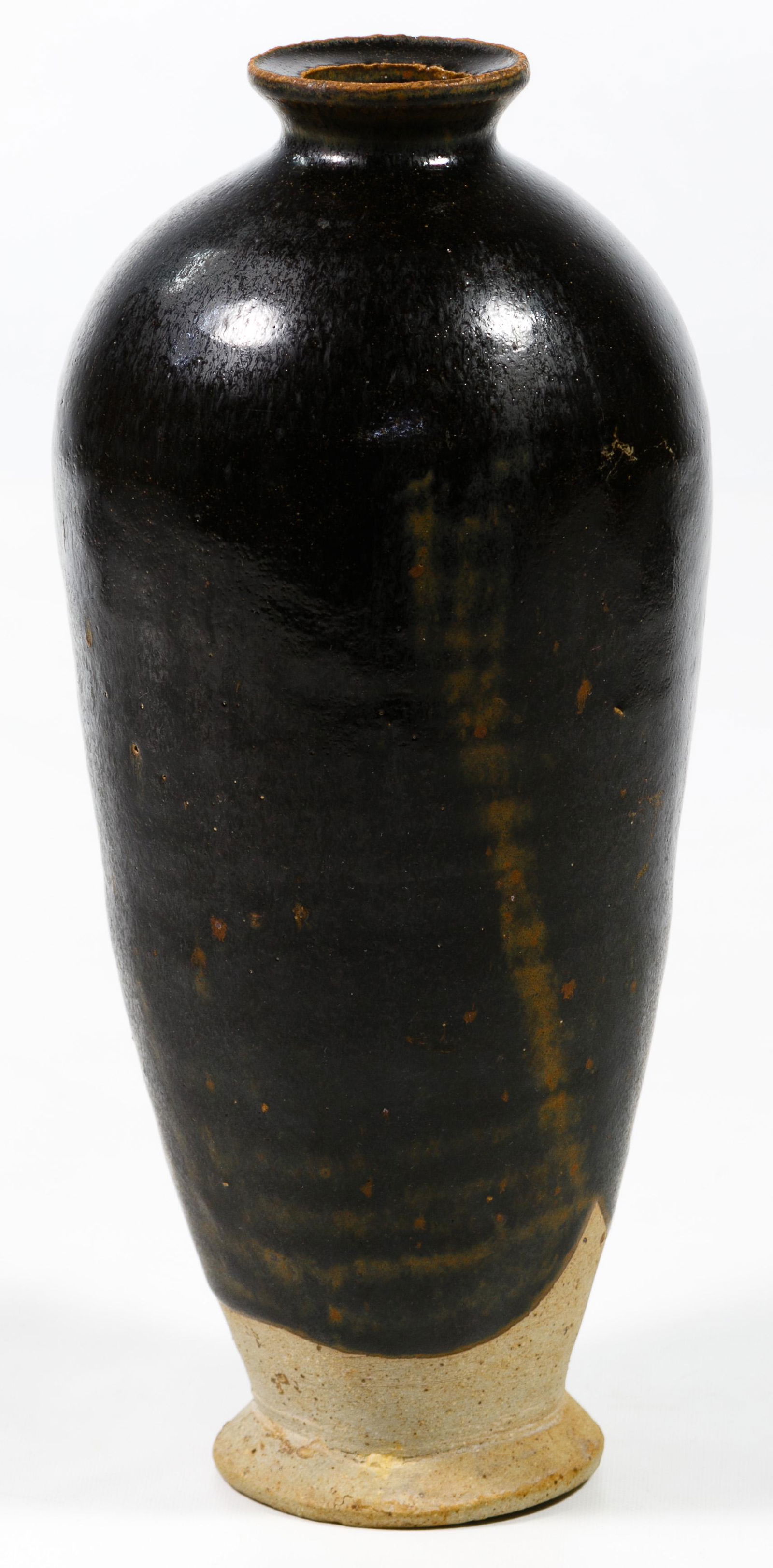 Ji Zhou Ware Brown Glaze Meiping Vase: Ji Zhou Ware Brown Glaze Meiping Vase Slender turned meiping shape showing tracks of the potter's fingers, having brown, black and russet splashed glaze inside and out Condition: Good, overall light w
