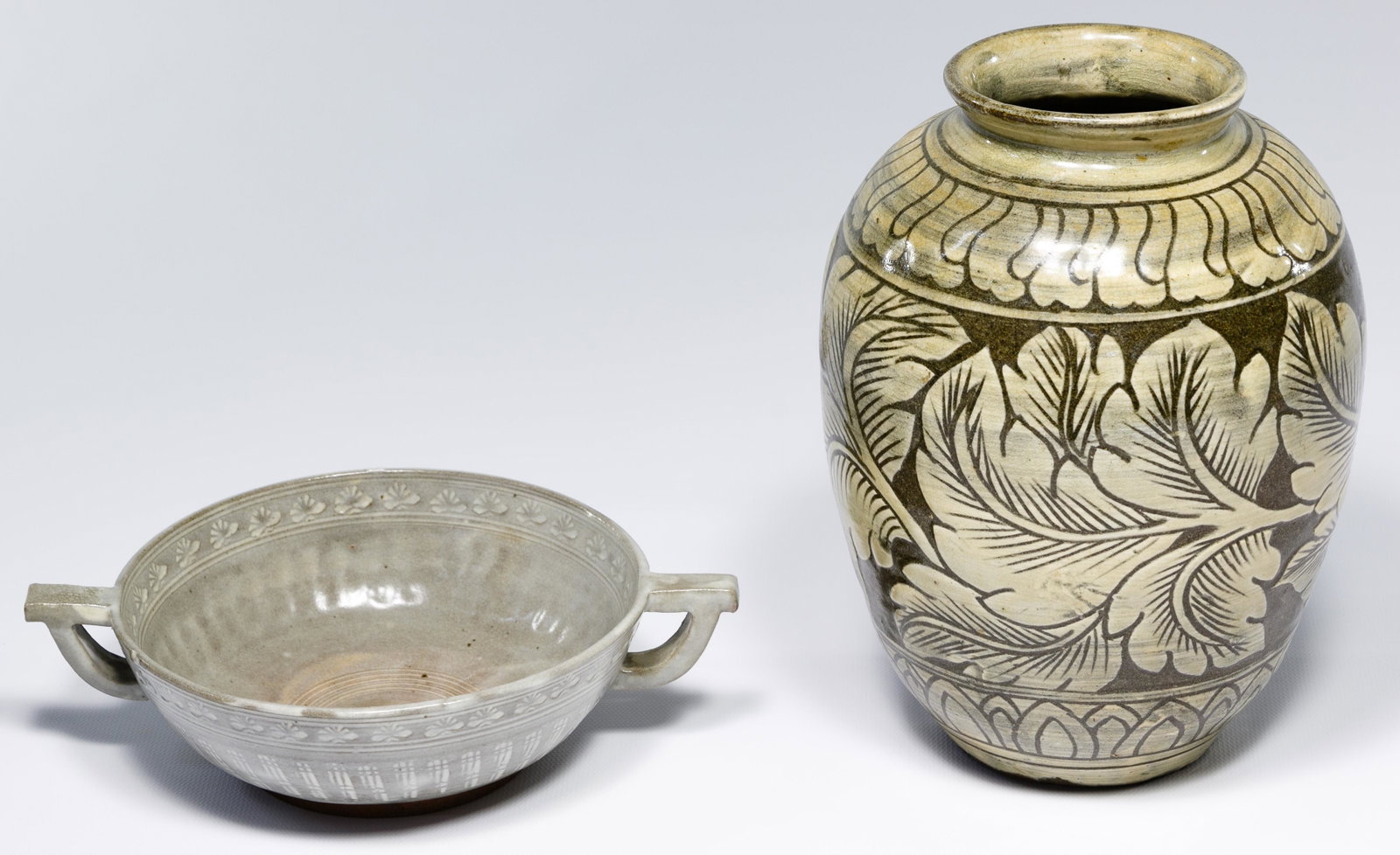 Korean Buncheong Pottery Assortment: Korean Buncheong Pottery Assortment Two items including a handled bowl and vase; the bowl having an impressed mark on the underside Condition: Very Good, no major chips or cracks noted; the vase havin