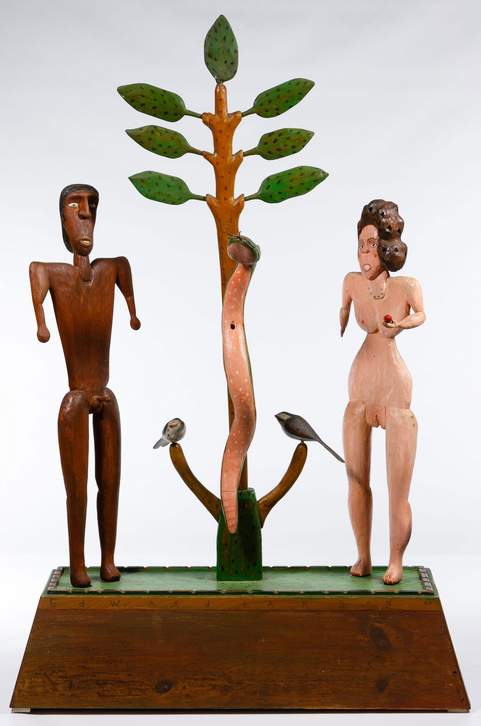 Ed Larson (American, 20th Century) 'Adam & Eve' Carved: Ed Larson (American, 20th Century) 'Adam & Eve' Carved Sculpture 1980, signed 'Edward Larson 80' at top front of base, 'Ed' on upper tree trunk front and 'Joplin, MO' on trunk back; painted wood sculp