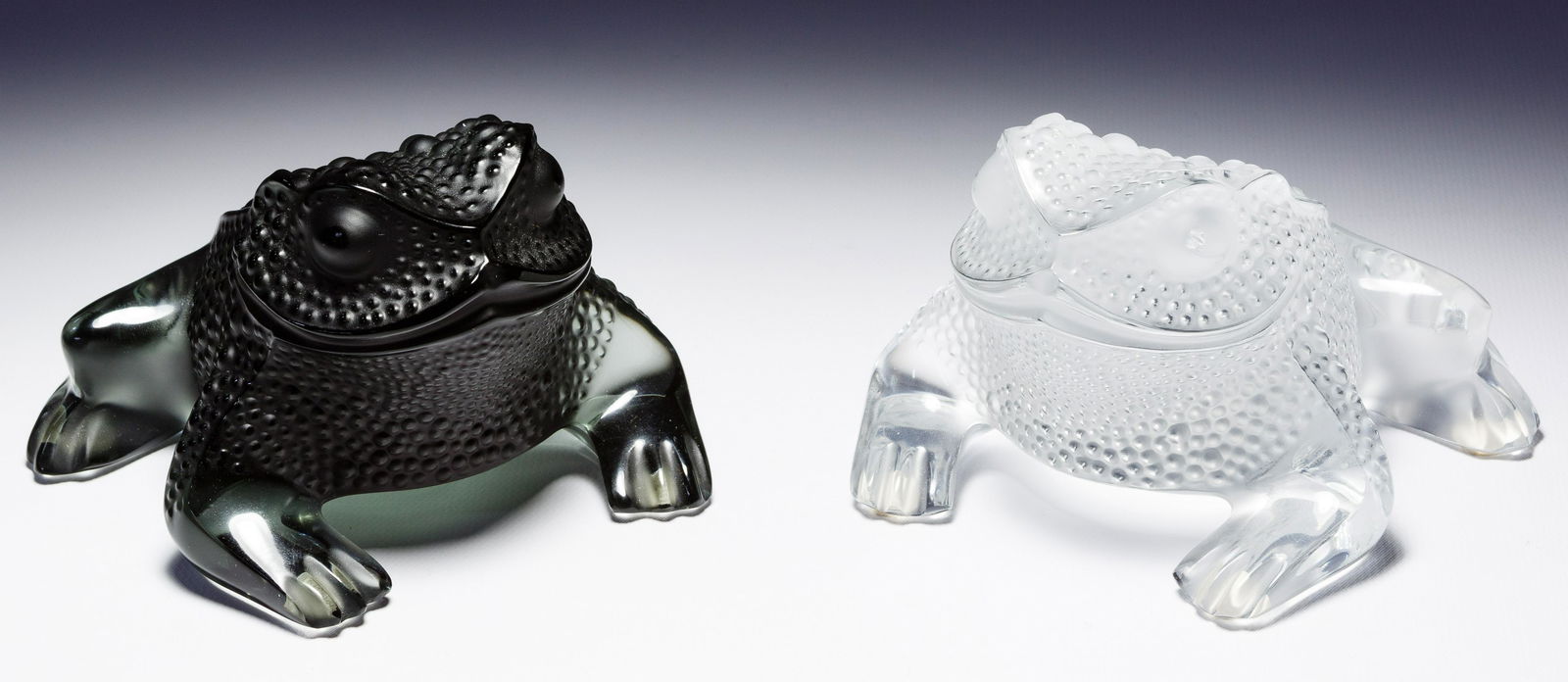 Lalique Crystal Frog Figurines: Lalique Crystal Frog Figurines Two items including a clear glass and a smoked glass frog, both signed on underside Condition: Excellent, overall light wear, both having small chipping on toes; no othe