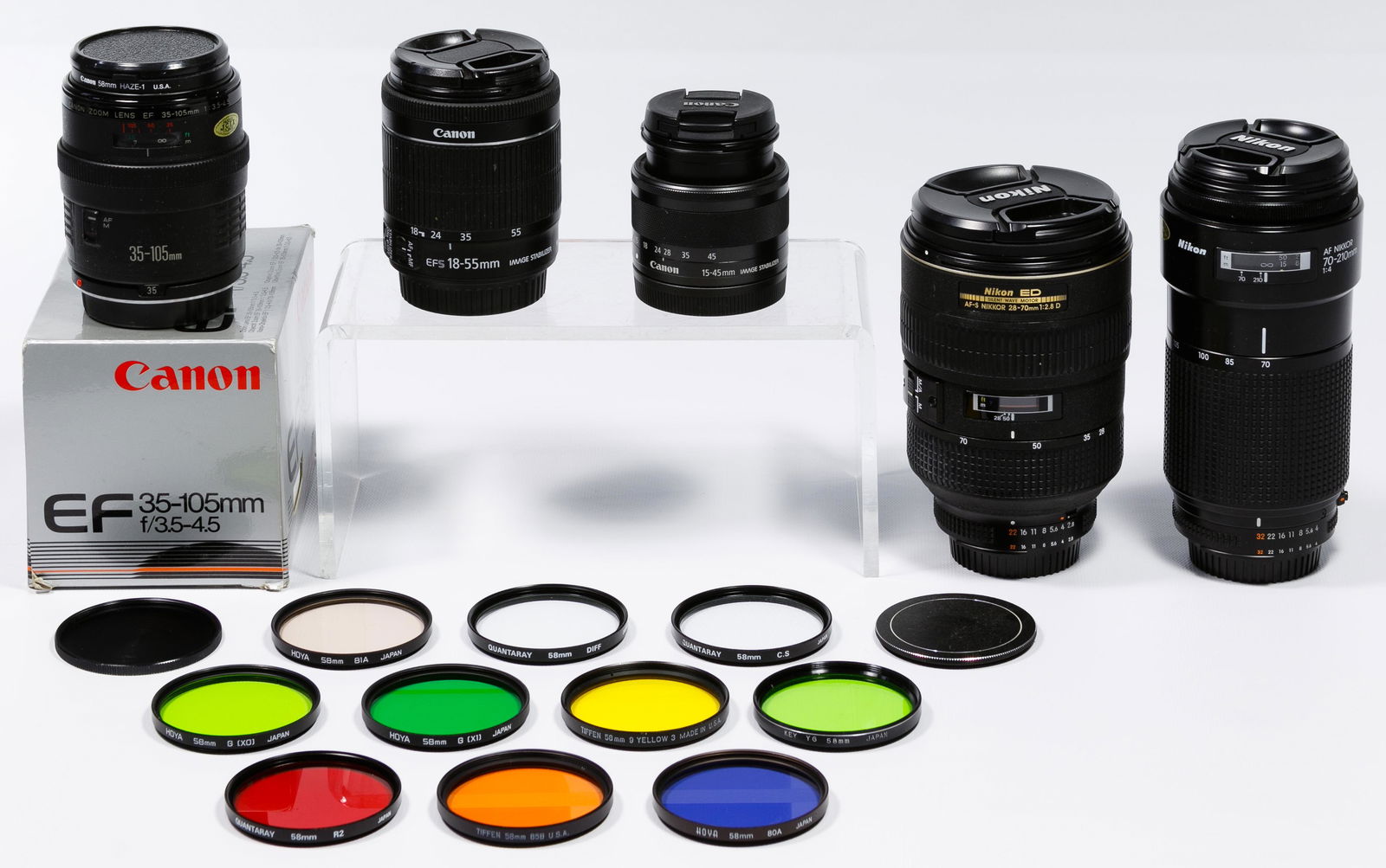 Nikon and Canon Camera Lens Assortment: Nikon and Canon Camera Lens Assortment Eighteen items including Nikon 'AF Nikkor 70-210mm' and 'AF-S Nikkor 28-70mm Nikon ED' both having lens caps, Canon 'Zoom Lens EF-M 15-45mm', 'Zoom Lens EF-S 18-