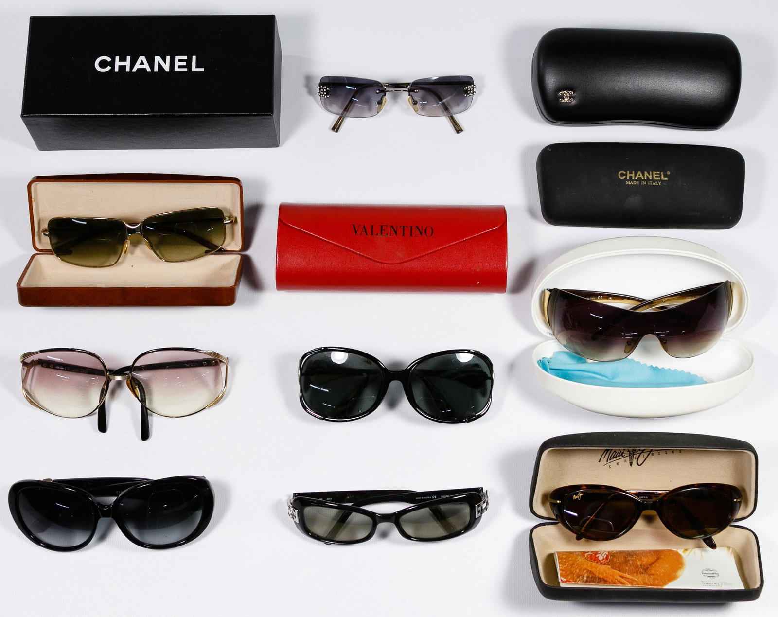 Designer Sunglasses Assortment: Designer Sunglasses Assortment Nine pairs including examples from Prada, Chanel, Maui Jim, David Yurm, Daniel Swarovski, Christian Dior and Armani; some having storage cases Condition: Very Good to Go
