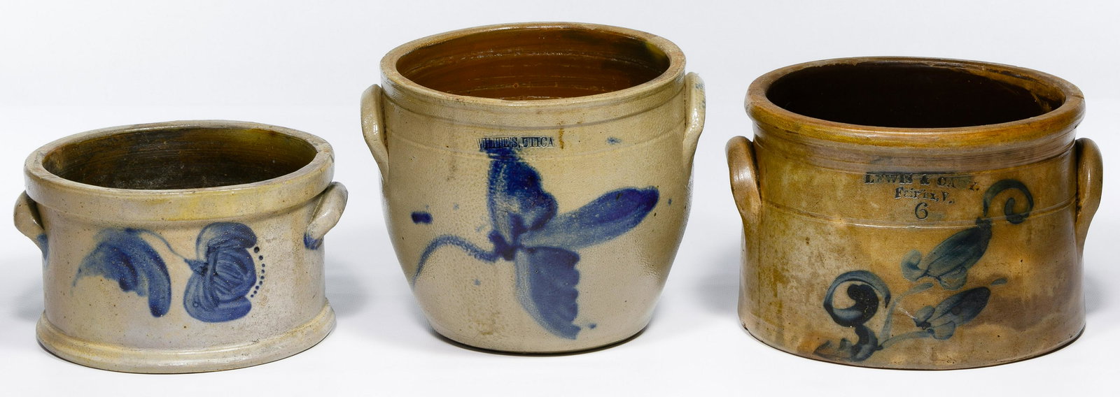 New York Stoneware Cobalt Blue Assortment: New York Stoneware Cobalt Blue Assortment Three double handled crocks having cobalt floral decorations, one stamped WHITES, UTICA and one stamped LEWIS & CADY, FAIRFAX, Va., the 6-quart crock unmarked