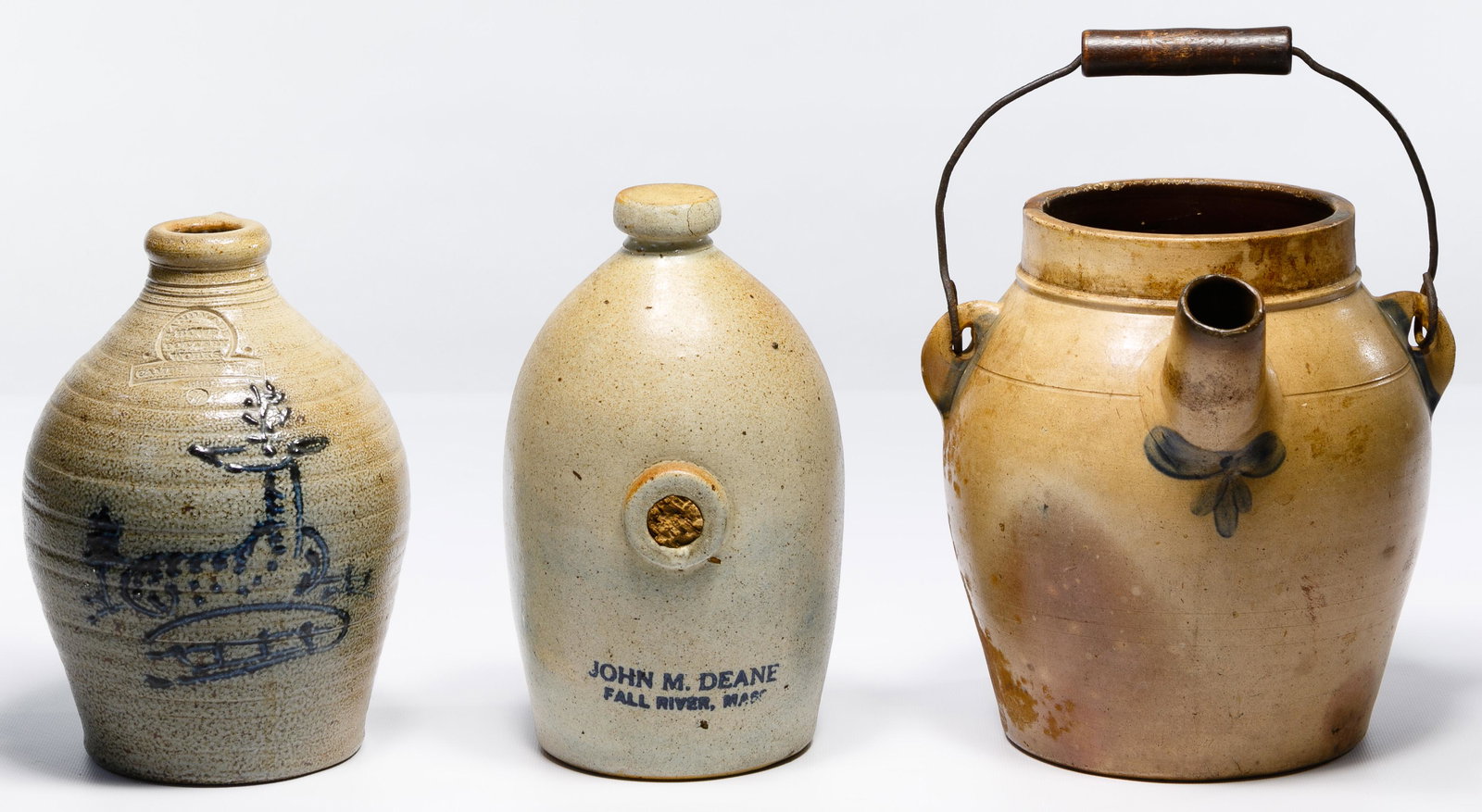 Stoneware Batter Pail, Bed Warmer and Jug: Stoneware Batter Pail, Bed Warmer and Jug Salt glazed and blue slip decorated spouted batter pail stamped 'SIPE & SONS, W.MSPORT, PA', a bed / foot warmer having stenciled blue slip 'JOHN M. DEANE FAL