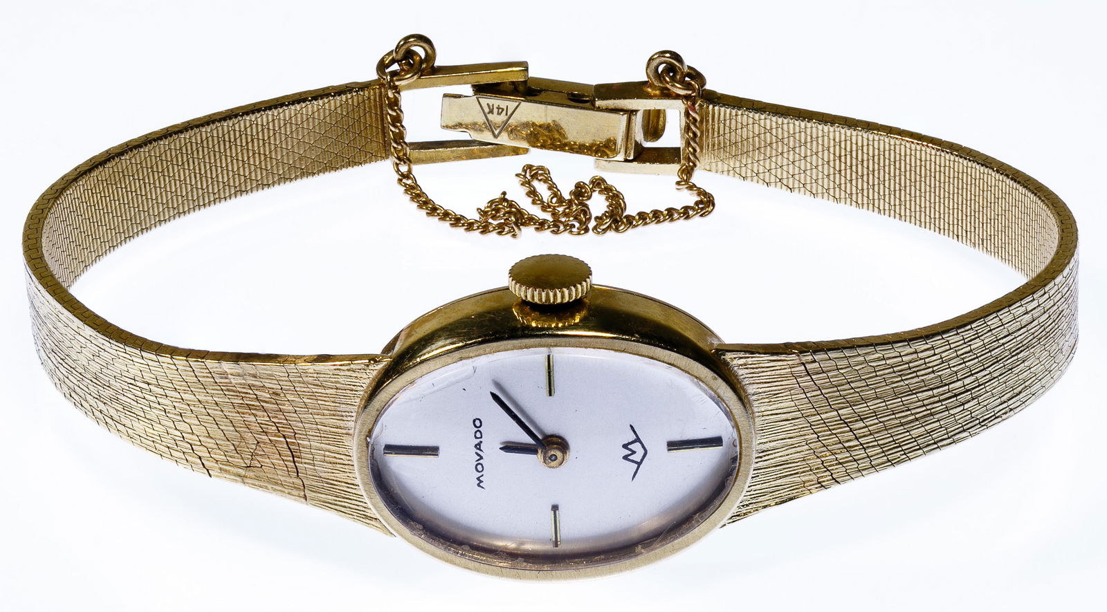 Movado 14k Gold Case and Band Wrist Watch: Movado 14k Gold Case and Band Wrist Watch Oval shape case, band, safety chain, clasp; marked '14k' back of case and clasp Condition: Very Good, overall light wear; not tested' we cannot guarantee the