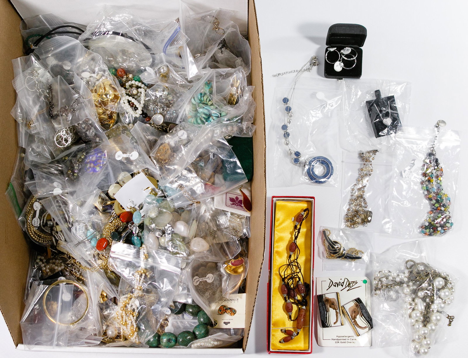 Costume Jewelry Assortment: Costume Jewelry Assortment Approximately twenty pounds of costume jewelry including pins, brooches, bracelets, chains, necklaces, earrings and Asian etched beads; most designer signed pieces Condition