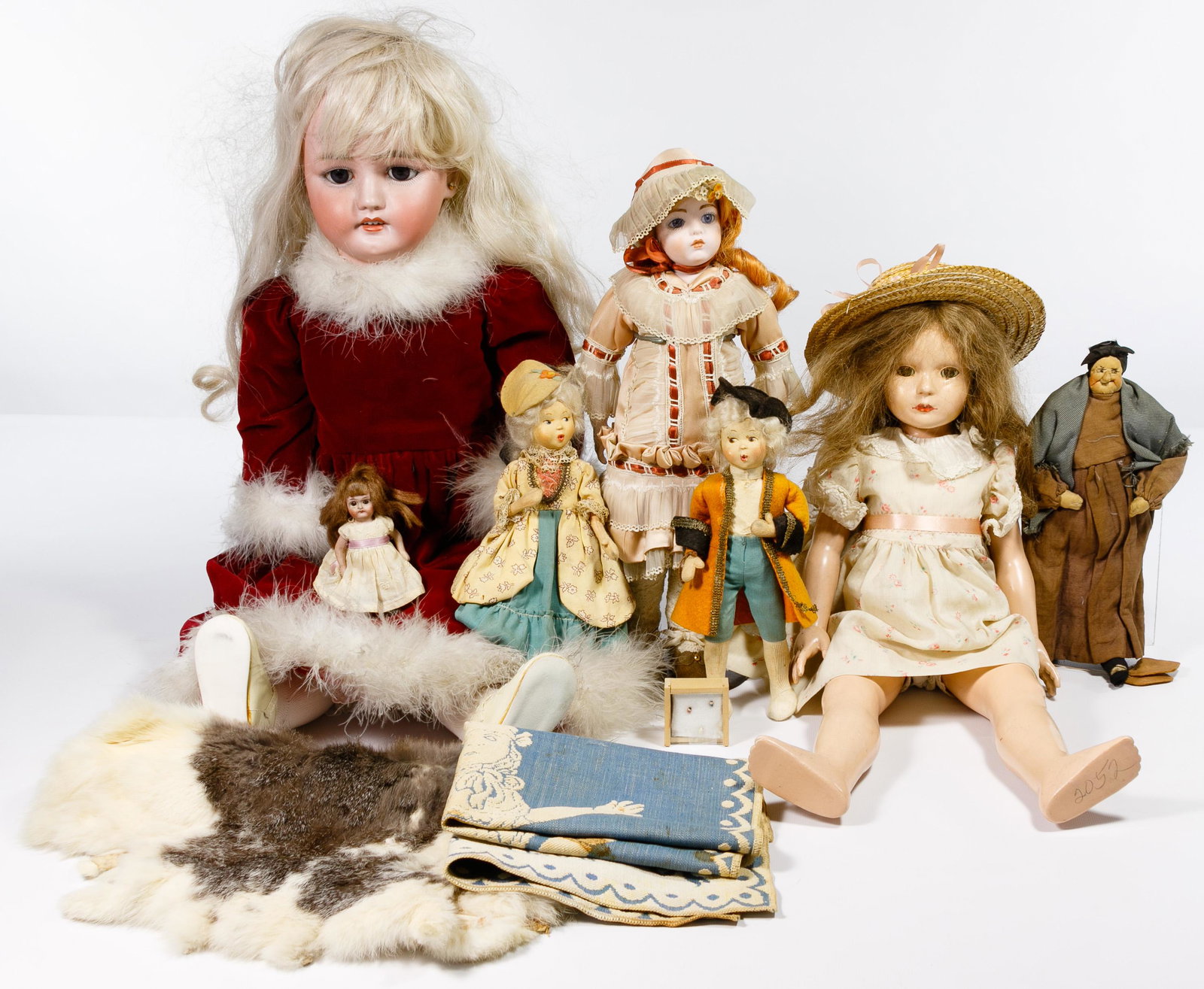 German Bisque Dolls: German Bisque Dolls Seven dolls including a C M Bergman, Simon and Halbig, swivel head, fully jointed body, painted eyebrows and lashes, blue sleep eyes, open mouth, showing four teeth, earrings as we
