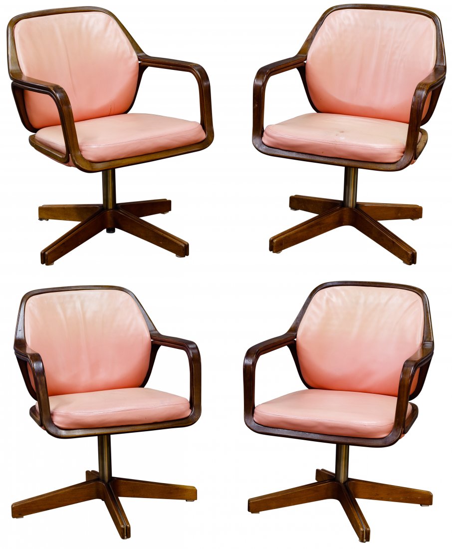 Don Pettit for Knoll Office Chair Collection: Don Pettit for Knoll Office Chair Collection c.1970, walnut bentwood armchairs on X-shaped swivel bases, having original peach color leather upholstery Condition: Good to Poor, casters removed; leathe