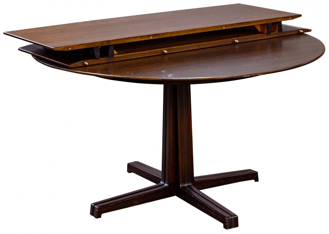 Edward Wormley for Dunbar Dining Table and Leaves: Edward Wormley for Dunbar Dining Table and Leaves c.1960; marked with D tag on underside; dark stained walnut two part circular top with two 18' extension leaves; together with custom table pads Condi