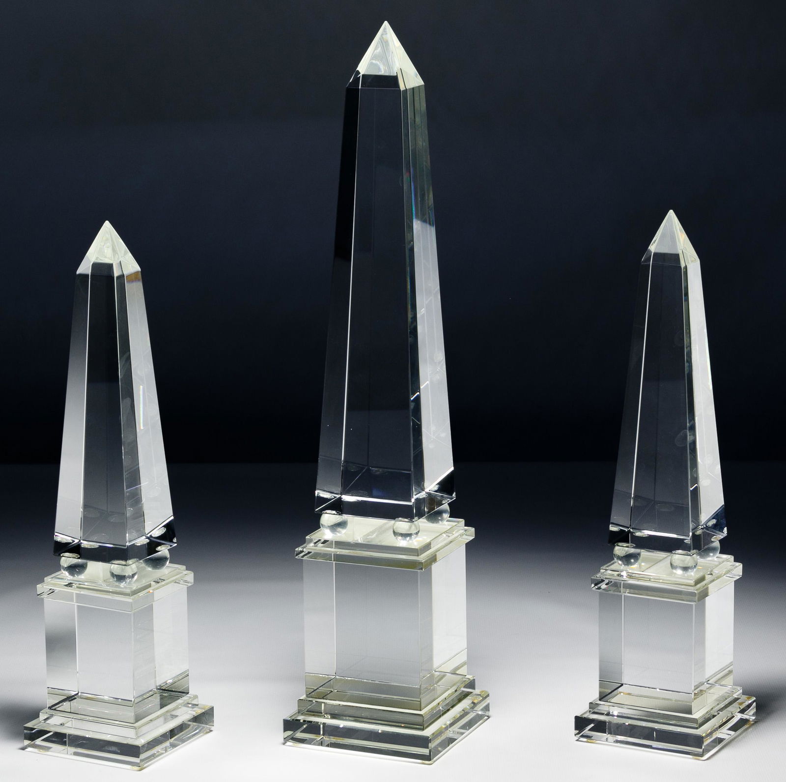 Crystal Obelisk Assortment: Crystal Obelisk Assortment Three items, unsigned, mounted on square bases Condition: Very Good, light wear; no chips or cracks noted Height: 16.00 inches, Width: 3.50 inches Category: Decorative Arts