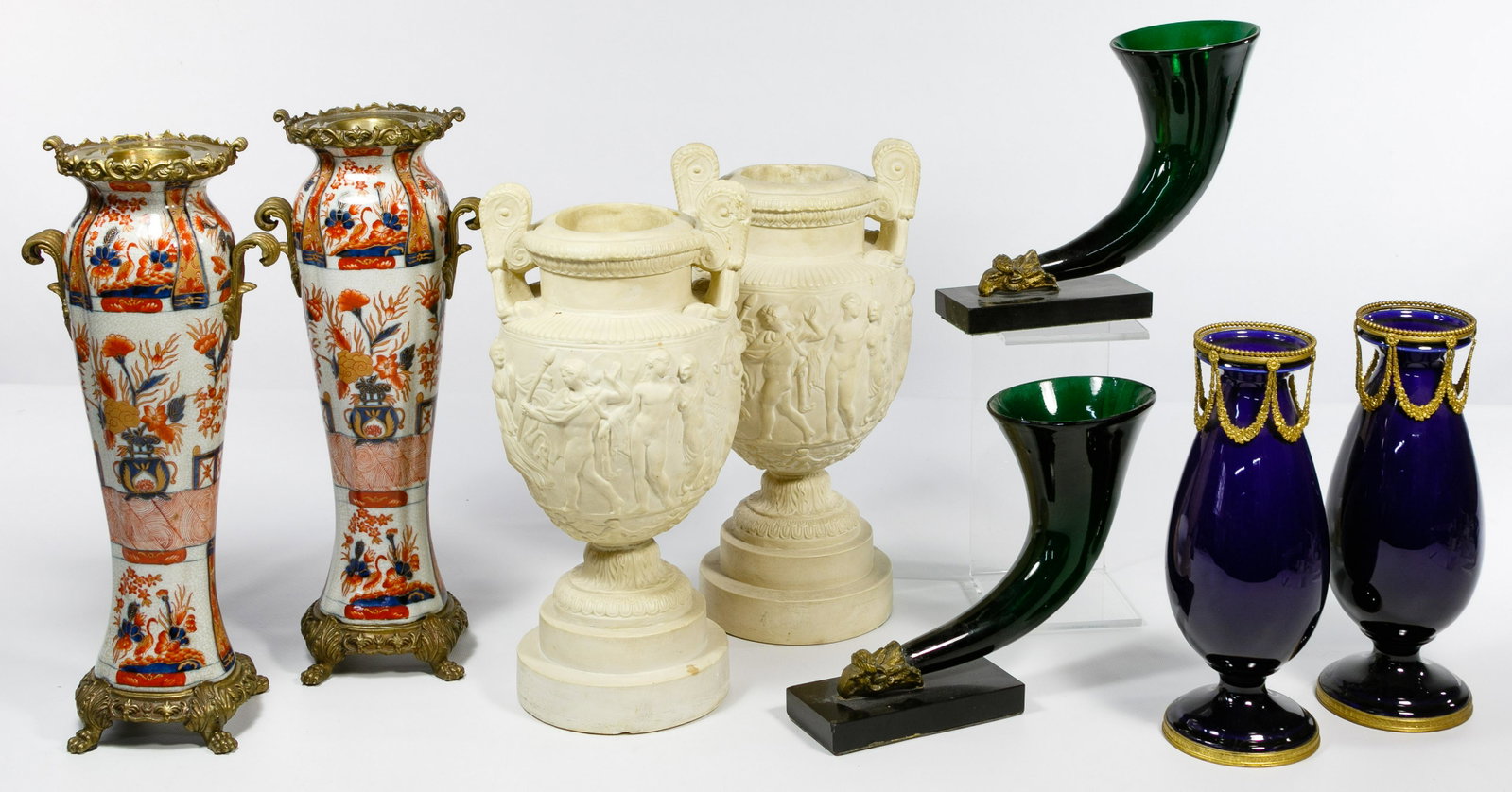 Vase Assortment: Vase Assortment Eight pieces making four pairs including an Asian style porcelain pair having brass mounts marked 'Castilian' on the undersides, a cobalt glass pair having metal mounts, a pair of rhyt