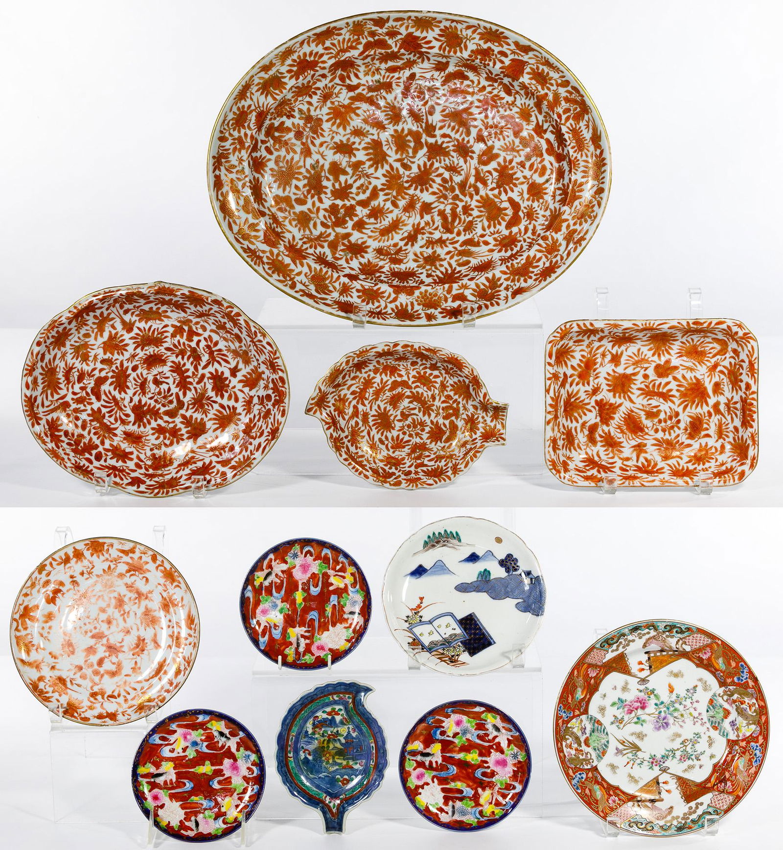 Asian Plate Assortment: Asian Plate Assortment Eleven items including a five piece serving set decorated in an all-over coral color floral motif with gold gilt having small leaf shaped serving dish, large oval platter, oval