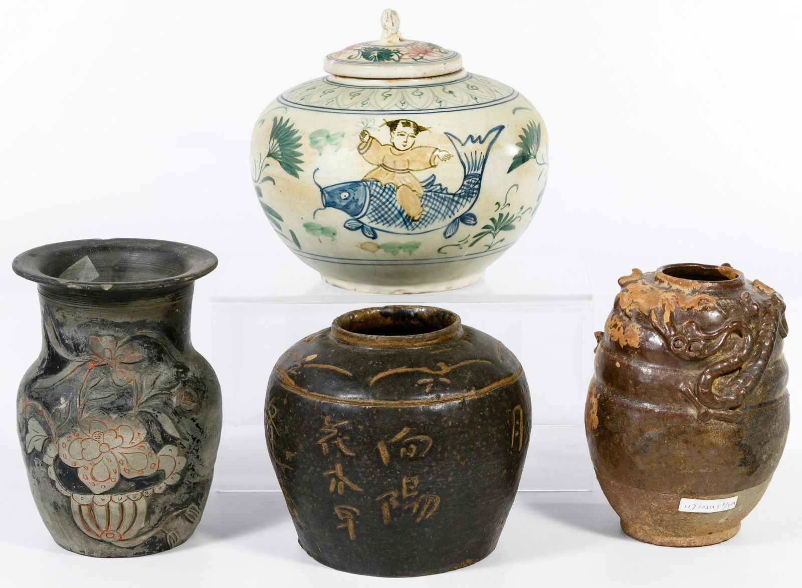 Chinese Style Jar Assortment: Chinese Style Jar Assortment Four items including a blue and iron oxide underglaze lidded jar having the Ming six character Xuande mark, an incised ginger jar having a thick brown glaze, a Song brown