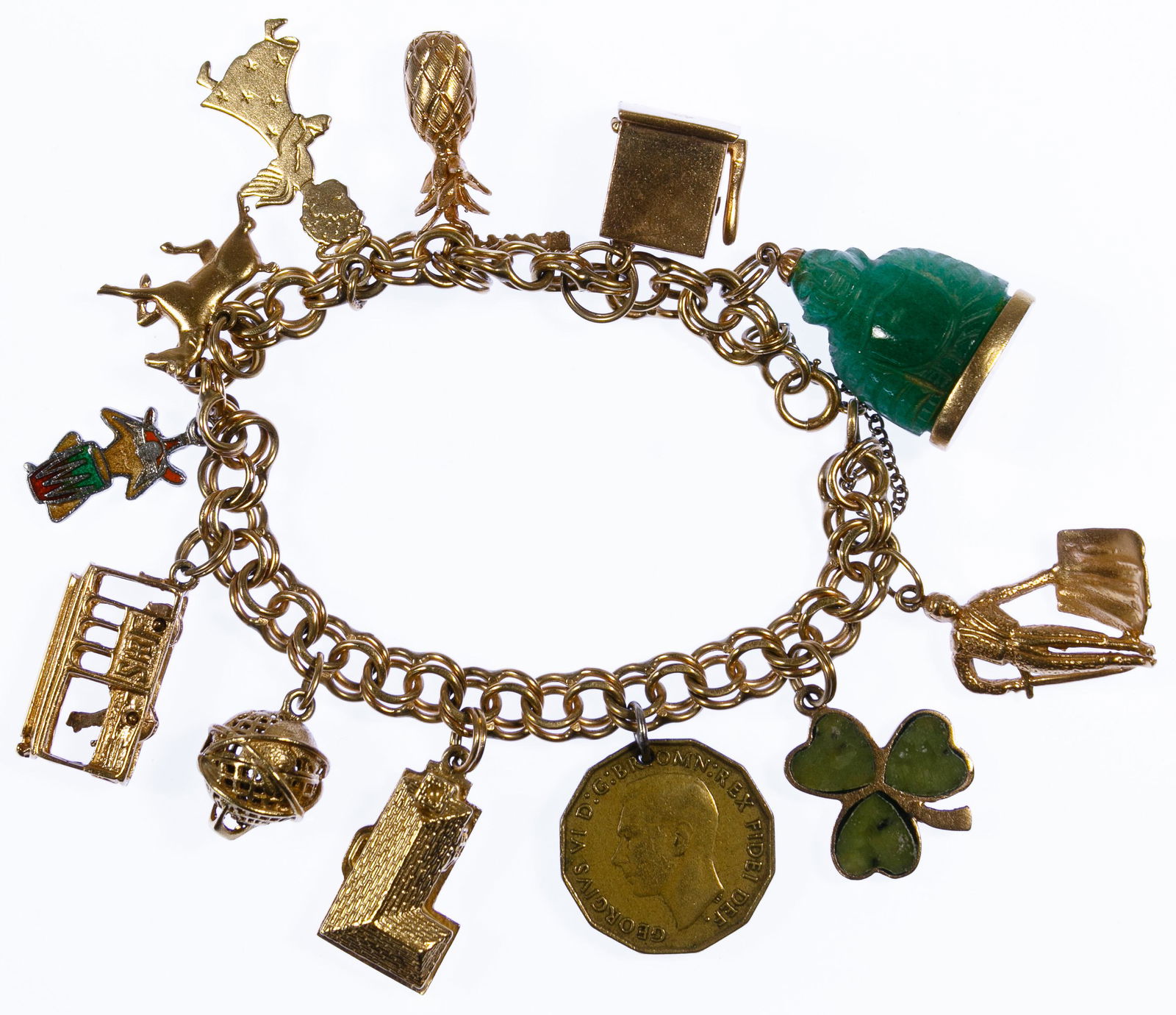 14k Gold Charm Bracelet: 14k Gold Charm Bracelet Marked '14k' on clasp and ten charms including a jadeite jade Buddha, a slot machine, a pineapple, an angel, a horse, a cable car, a sphere, a house, a clover and a matador as