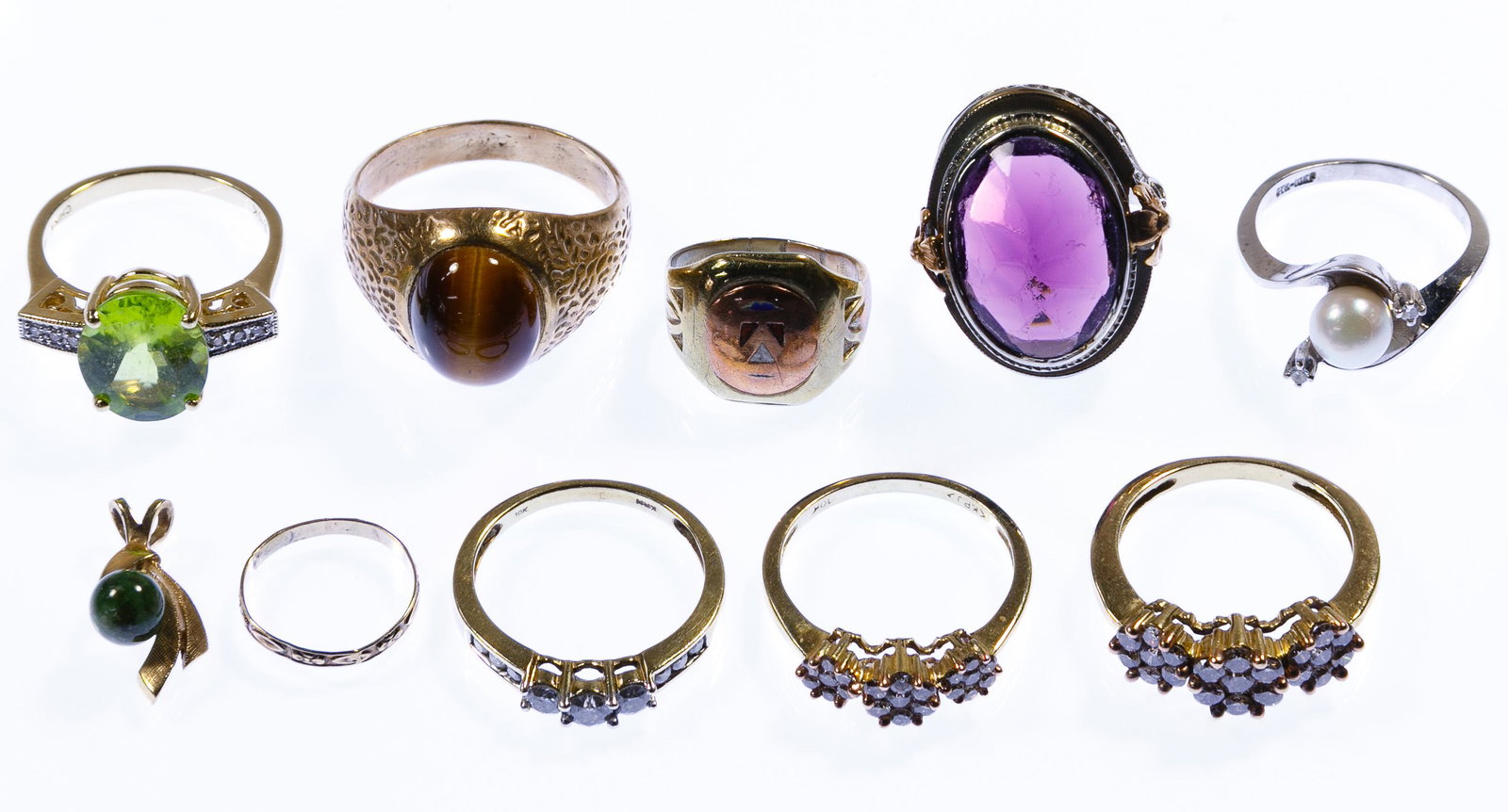 10k Gold Jewelry Assortment: 10k Gold Jewelry Assortment Including nine rings in white, rose and yellow gold as well as a wishbone pendant having a jadeite jade bead; most marked '10k' Condition: Very Good to Good, overall light 