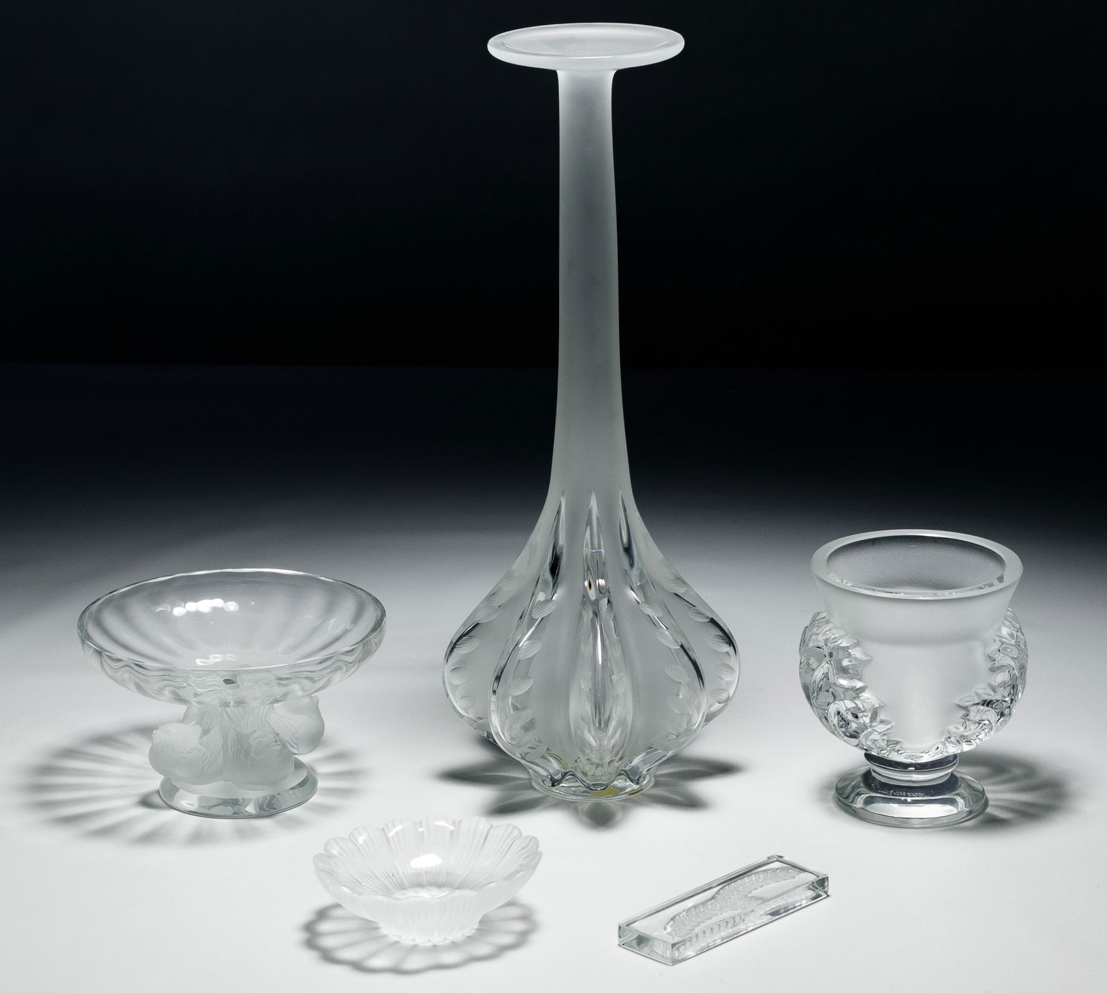 Lalique Crystal Assortment: Lalique Crystal Assortment Five items including a 'Marie Claude' vase signed 'M.C. Lalique 4-5-89', an 'Acanthus' vase, a 'Nogent' candy dish, a 'Paquerettes' trinket dish and a 'Hortense' knife rest;