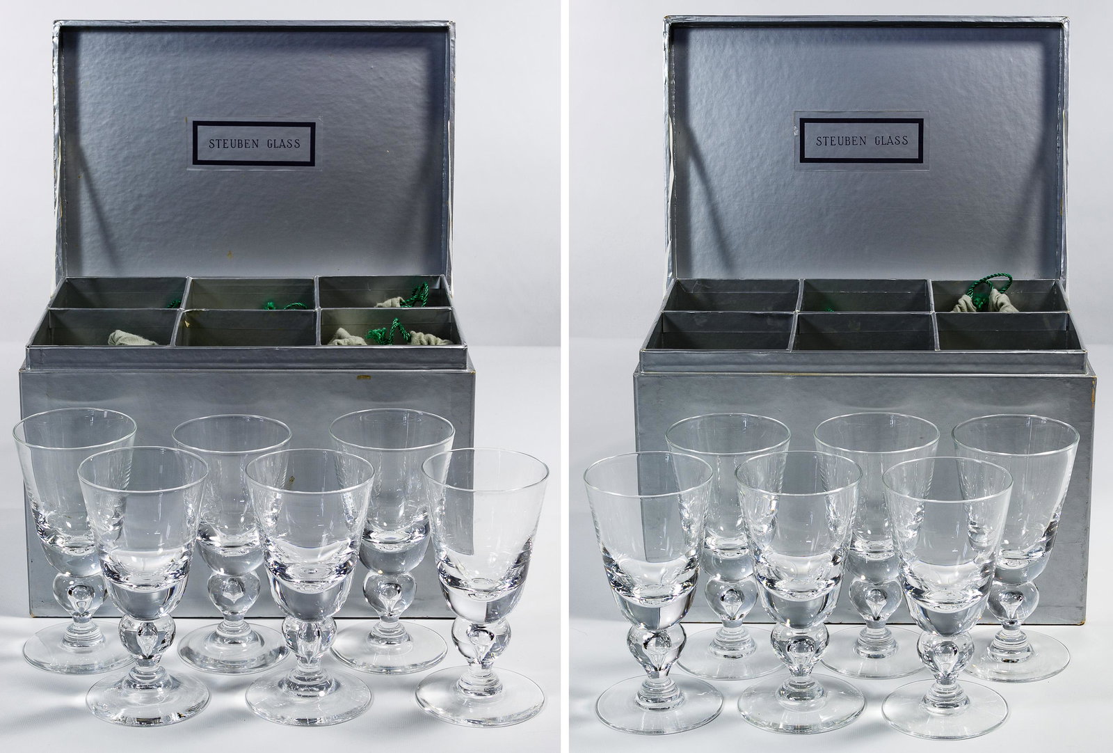 Steuben '7877' Water Goblets Collection: Steuben '7877' Water Goblets Collection Twelve items, clear having a baluster stem, in original felt bags and Marshall Fields boxes Condition: Very Good, light wear; no chips or cracks noted, boxes wr