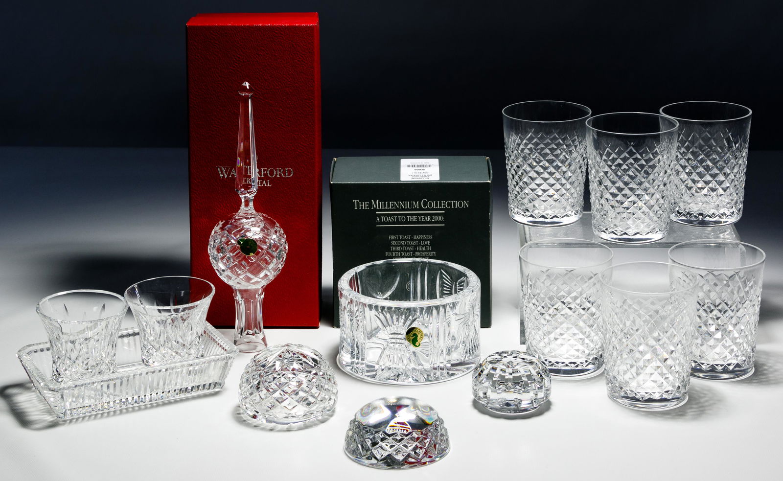 Waterford Crystal Assortment: Waterford Crystal Assortment Fourteen items including a tree-topper, set of six 'Alana' double old fashion tumblers, three paperweights, 'Millennium' bottle coaster, relish tray having clock etching a