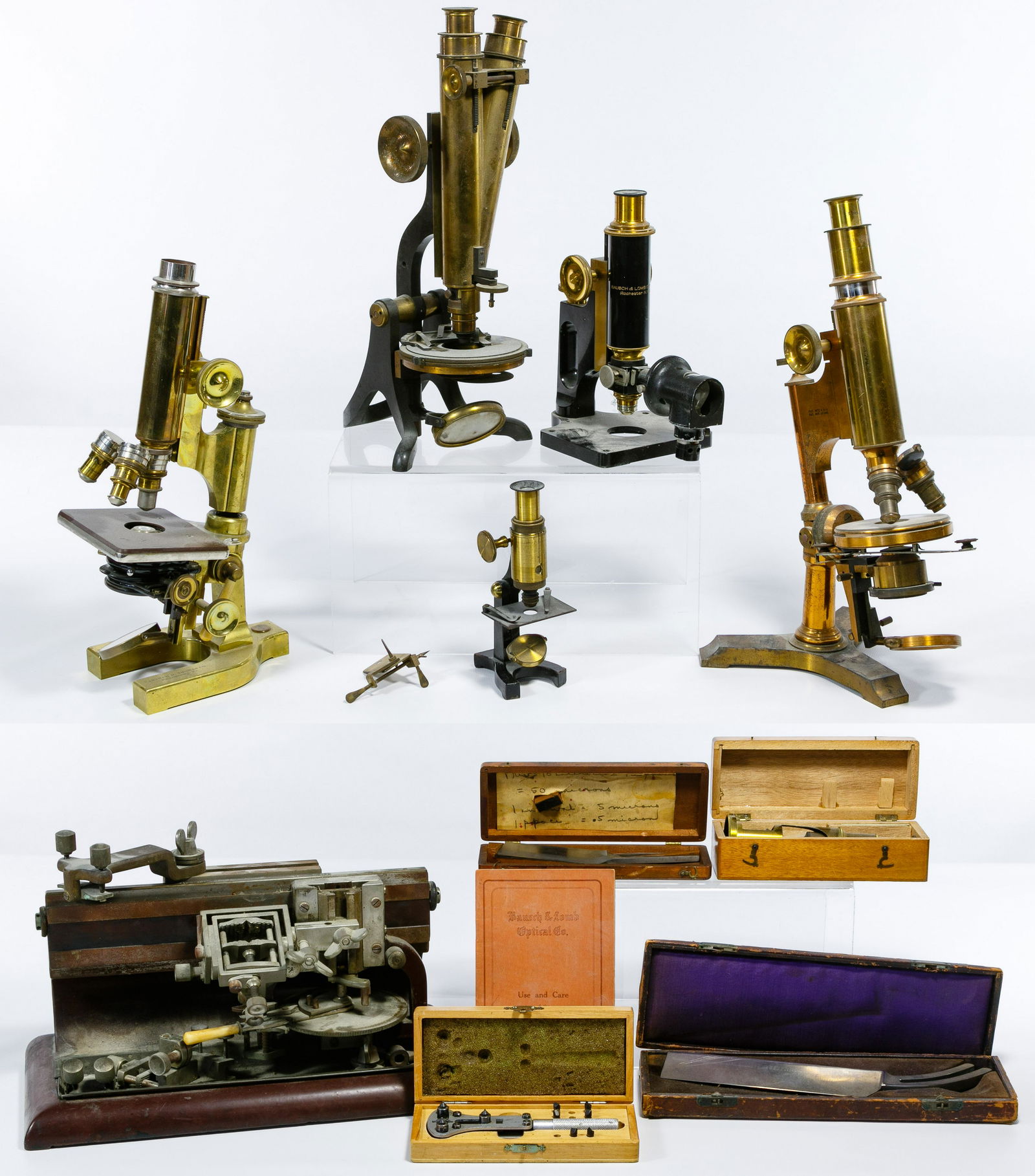 Microscope and Microtome Assortment: Microscope and Microtome Assortment Ten items including five brass and metal microscopes with three marked 'Bausch & Lomb', a 'Henry Crouch, London' and an unmarked; a 'Bausch & Lomb' microtome having
