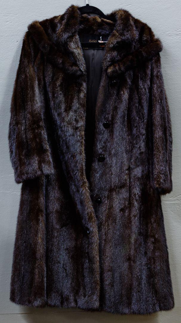Mink Fur Coat: Mink Fur Coat Dark brown fur with shawl collar and slit pockets, three quarter length, 'Mables Denver' label Condition: Very Good, overall light wear consistent with age and normal use; slight tear by