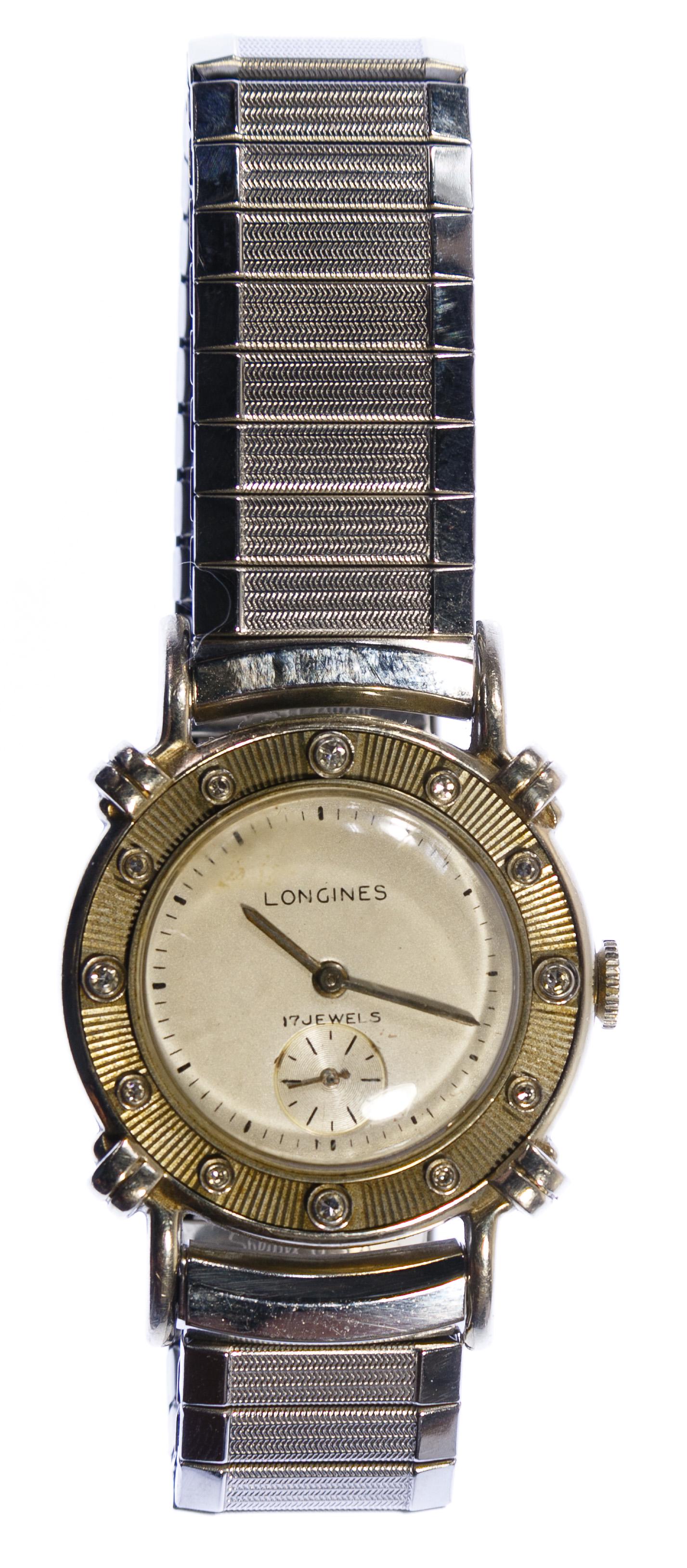 Longines 14k Gold Case Wrist Watch: Longines 14k Gold Case Wrist Watch Serial # 7498845 having 17-jewel Swiss movement, bezel having small round cut diamonds for the number markers, mounted on a stretchable band; marked '14k' inside bac