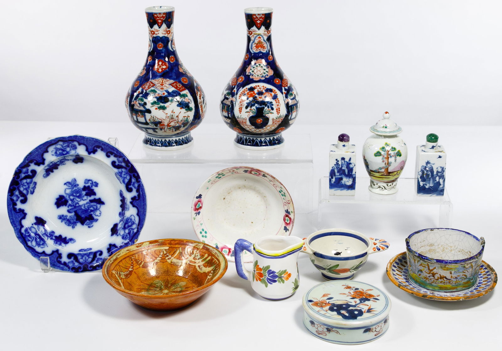 Asian and Dutch Pottery Assortment: Asian and Dutch Pottery Assortment Twelve items including two blue vases, two snuff bottles with jadeite stoppers, five bowls, a small ginger jar with lid; together with a Quimper sugar and cream set