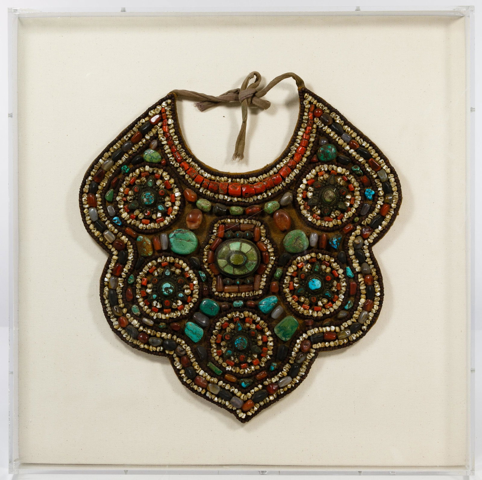 Asian Ladakh Necklace: Asian Ladakh Necklace 20th century necklace from tribal India having coral, turquoise, carnelian and mother-of-pearl beads attached to textile; mounted in a plexiglass frame and accompanied by origina