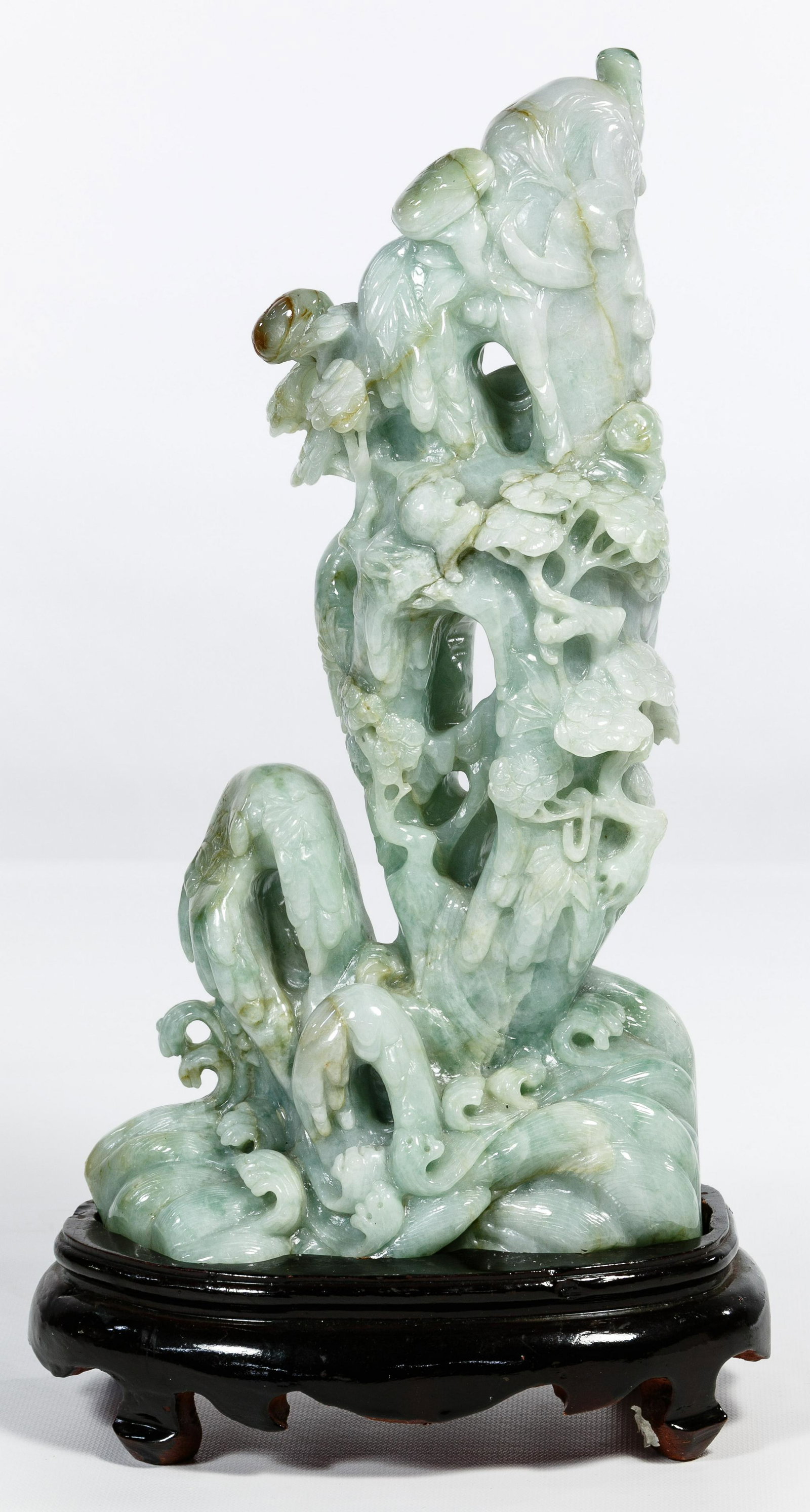 Chinese Jadeite Jade Willow Tree Carving: Chinese Jadeite Jade Willow Tree Carving Detailed carving depicting a weeping willow tree, flowers on a rocky crag having crashing waves, light green color having darker suffusions, hand carved stand 