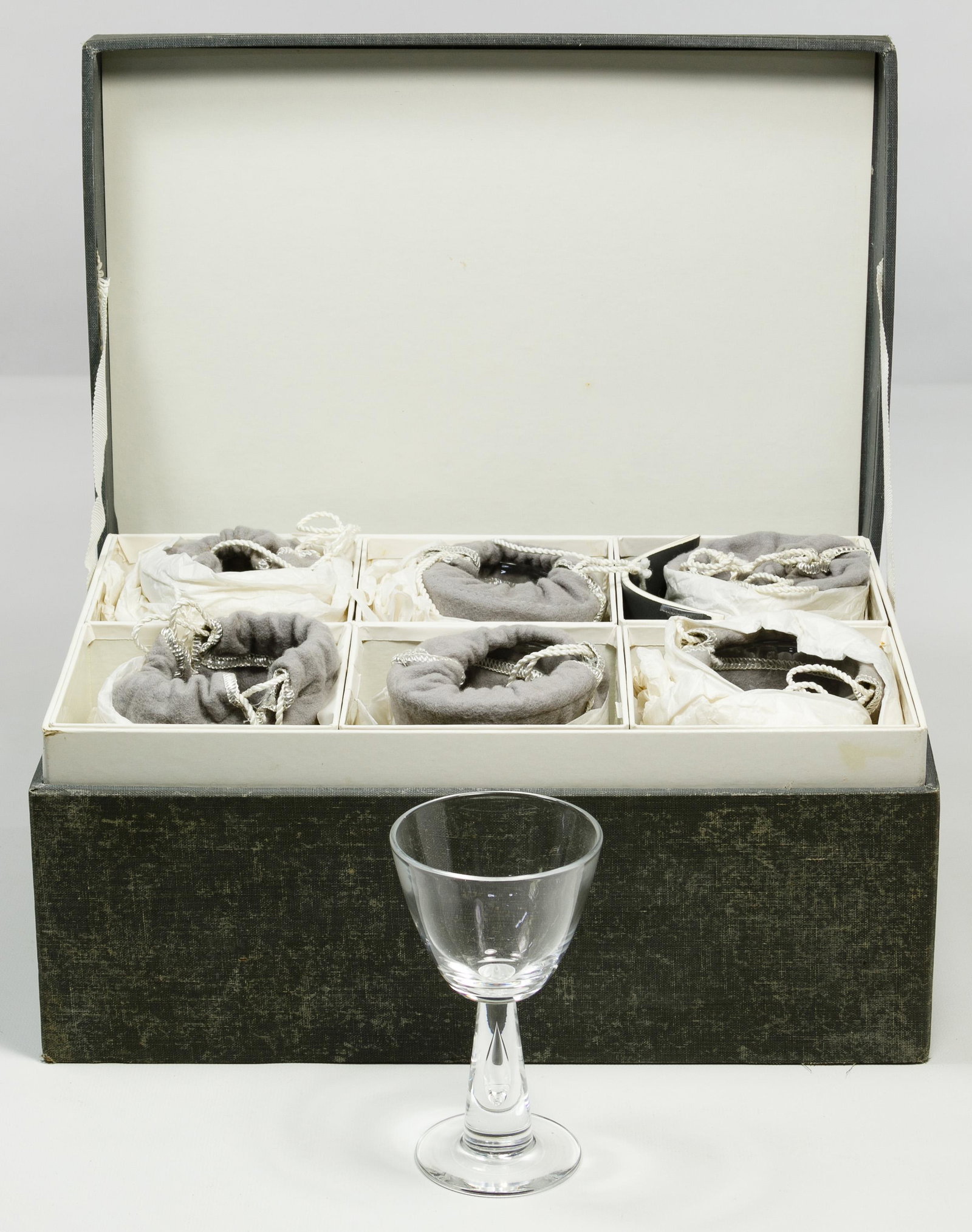 Steuben '7980' Air Bubble Wine Glass Collection: Steuben '7980' Air Bubble Wine Glass Collection Six items, each having an air bubble in the stem; original box, instruction booklet and cloth bags Condition: Very Good, no chips or cracks noted; heavy