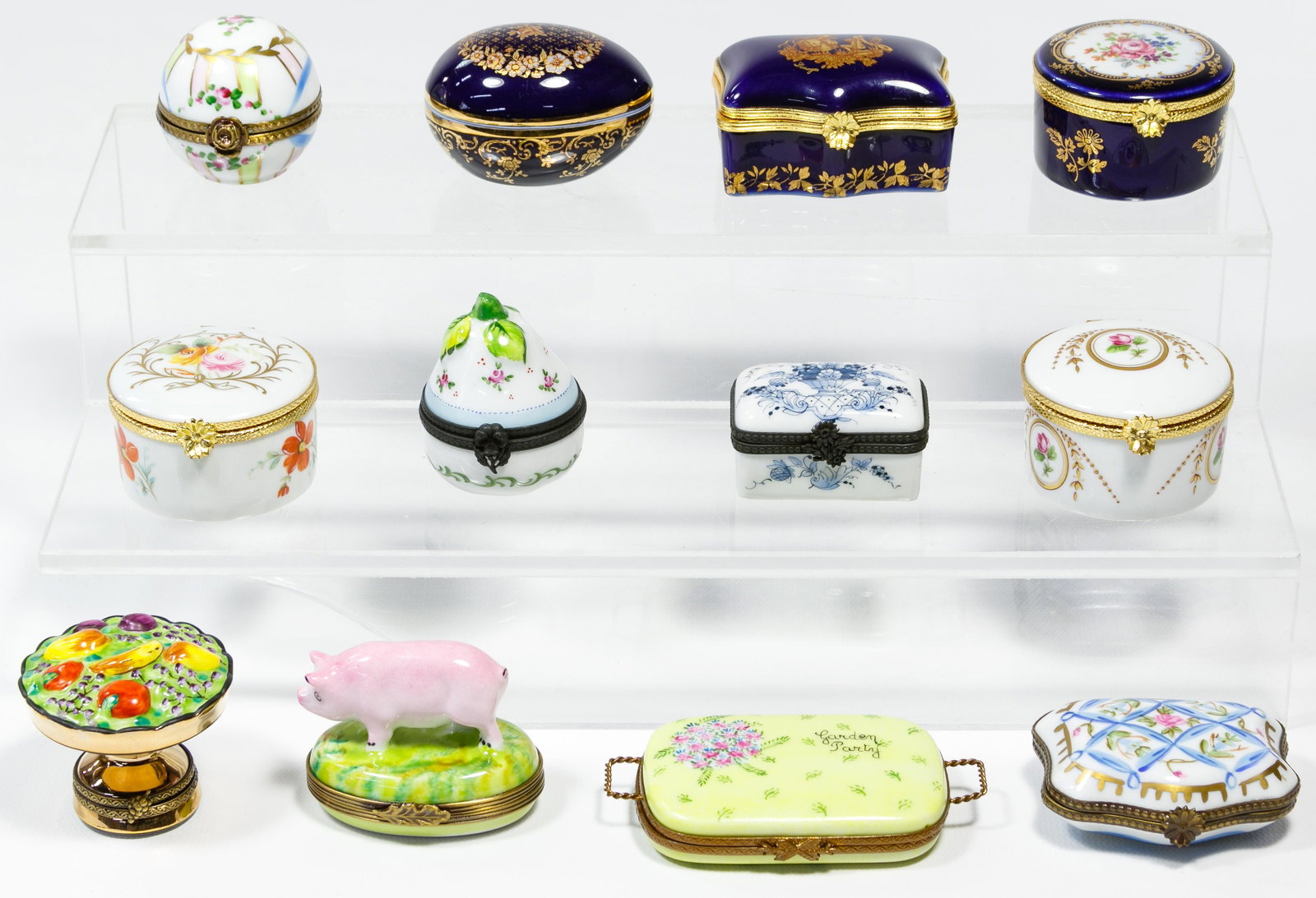 Limoges Trinket Box Assortment: Limoges Trinket Box Assortment Twelve items in various shapes and styles, including garden party, piggy, vegetable compote, all having hinged lids, all marked Condition: Very Good, no damage noted; no